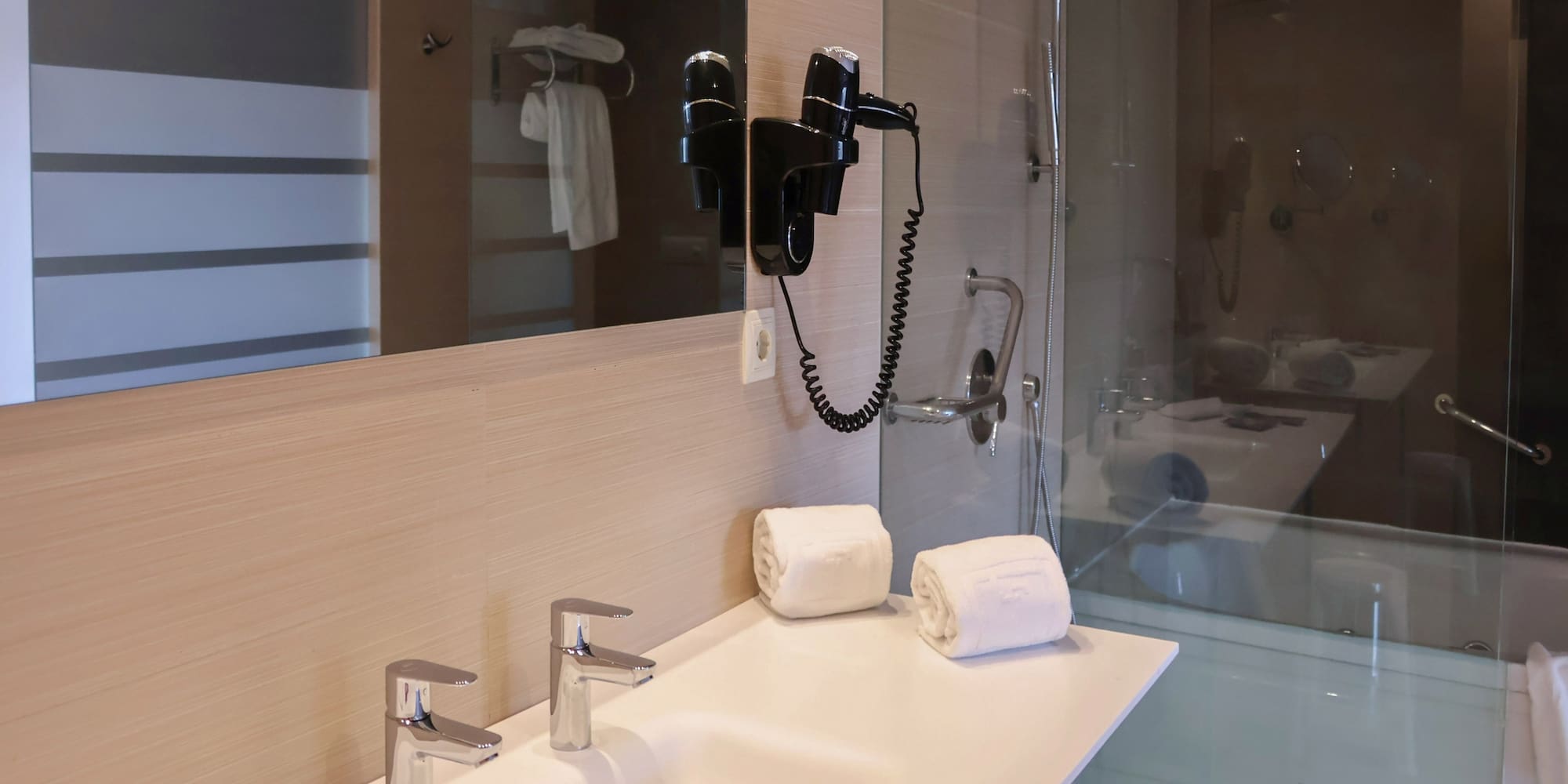 a bathroom with a shower and a sink