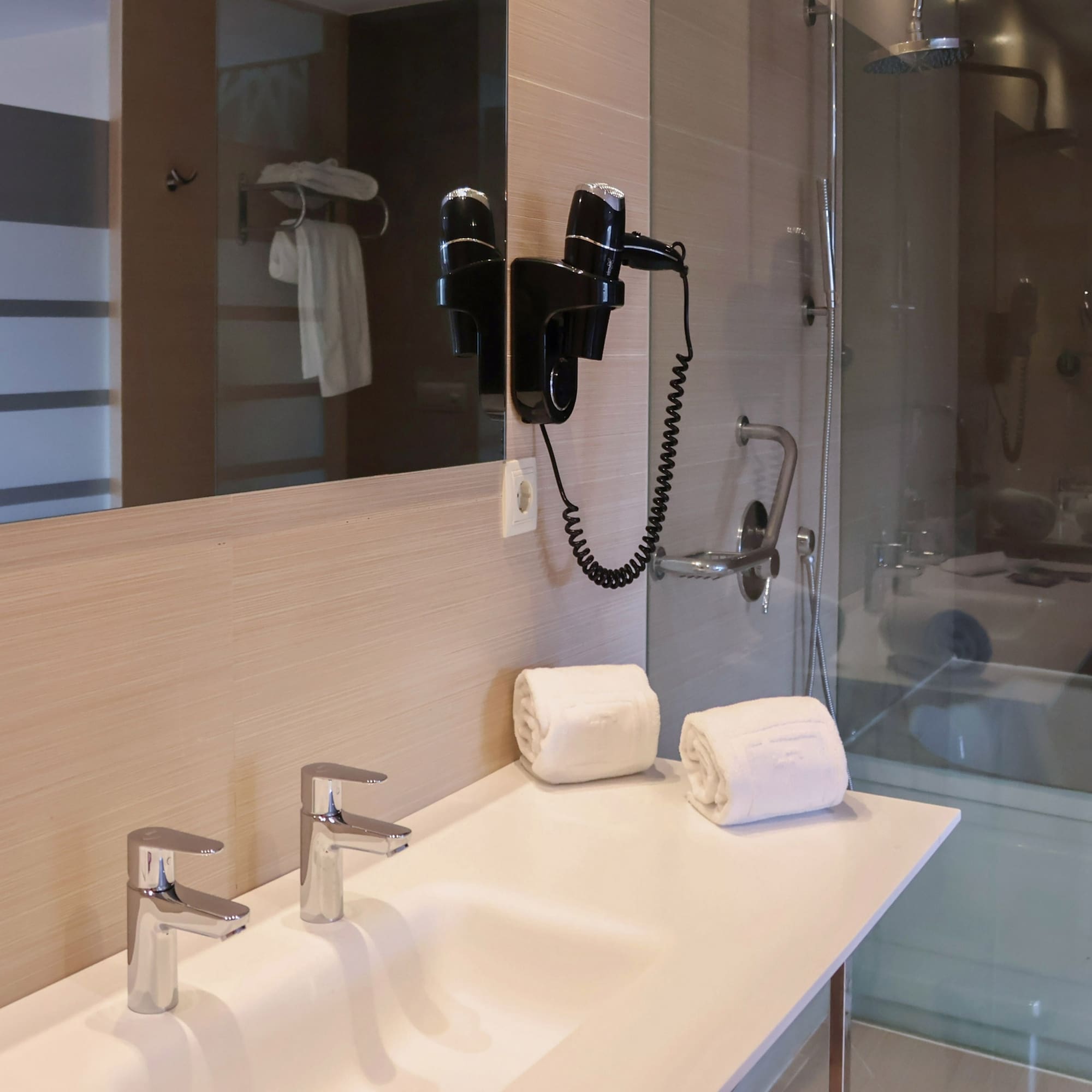 a bathroom with a shower and a sink