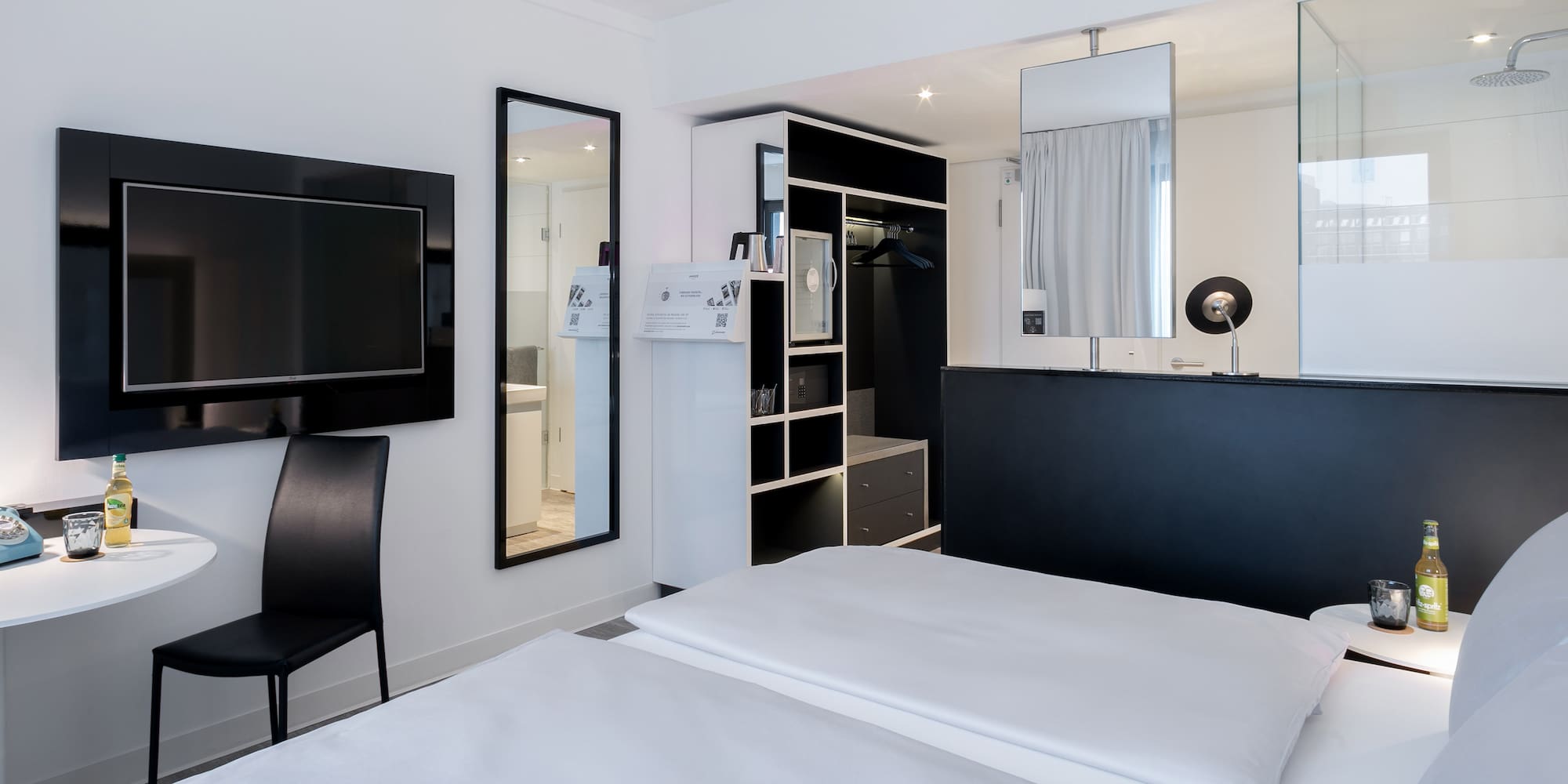 a bedroom with a black and white bed