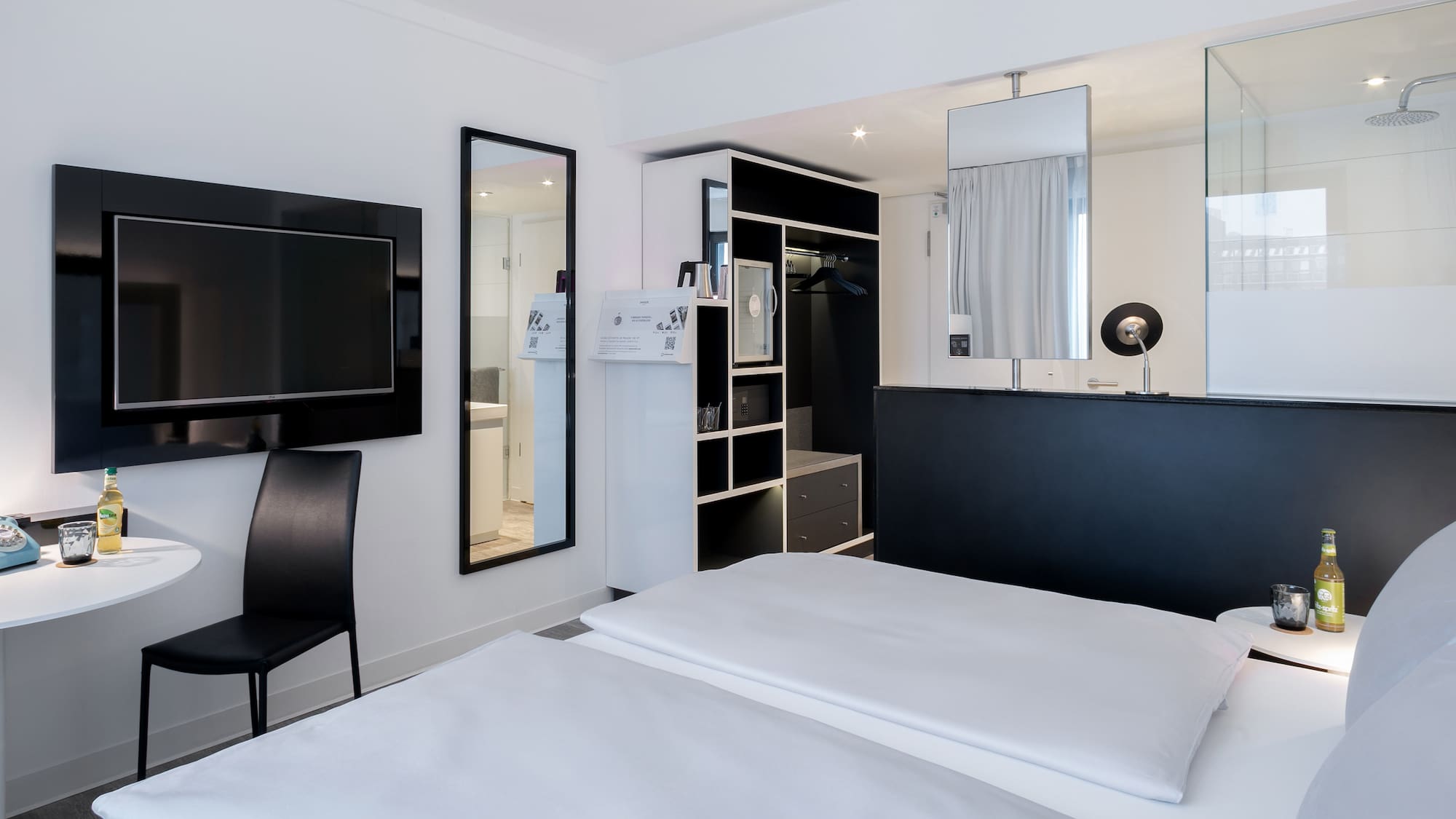 a bedroom with a black and white bed