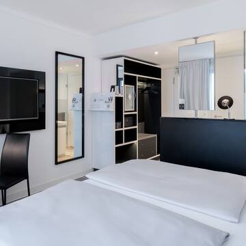 a bedroom with a black and white bed