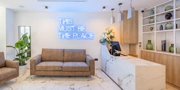 a reception desk and a couch in a room