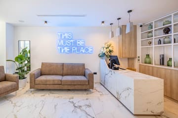 a reception desk and a couch in a room