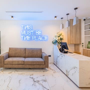 a reception desk and a couch in a room