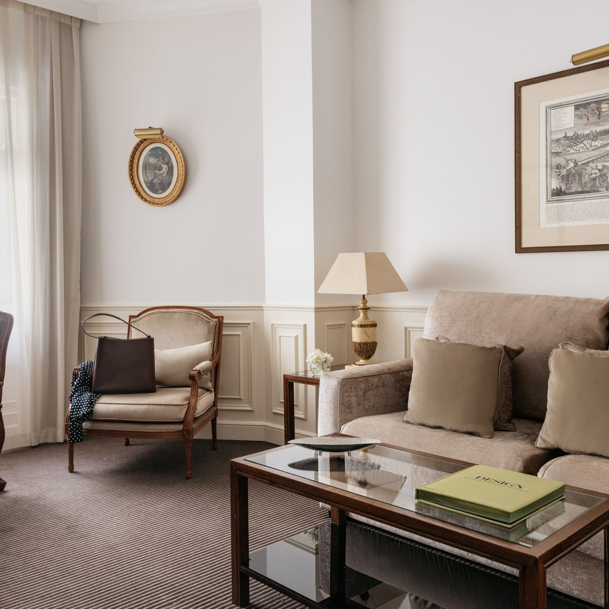 a living room with a couch and chairs