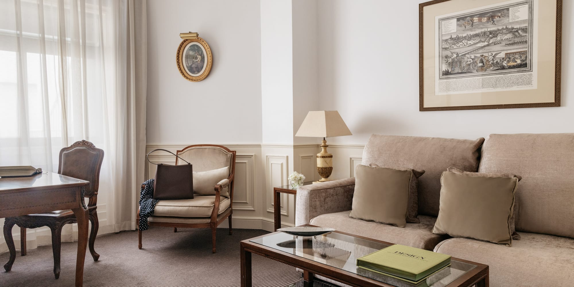 a living room with a couch and chairs