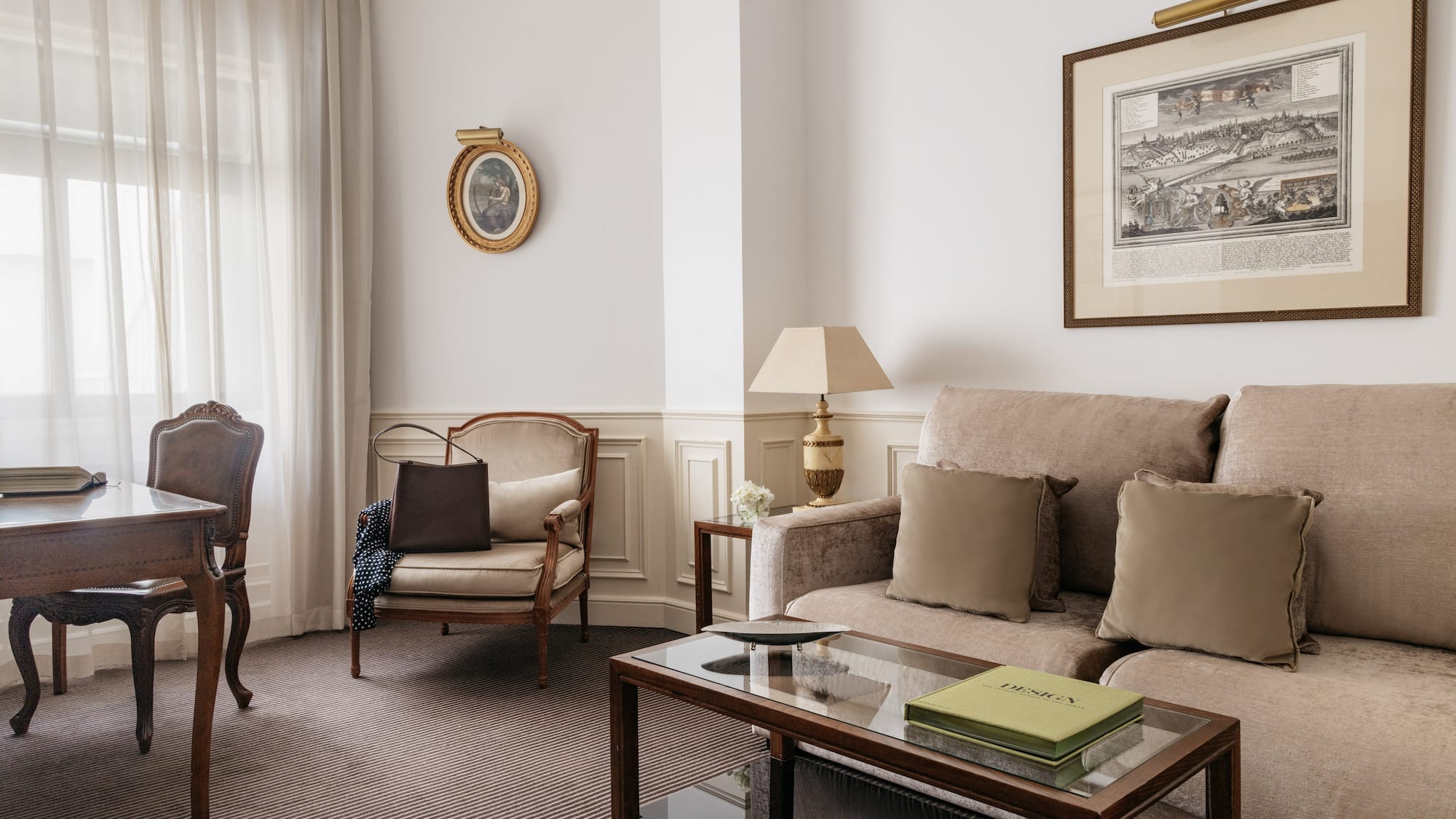 a living room with a couch and chairs