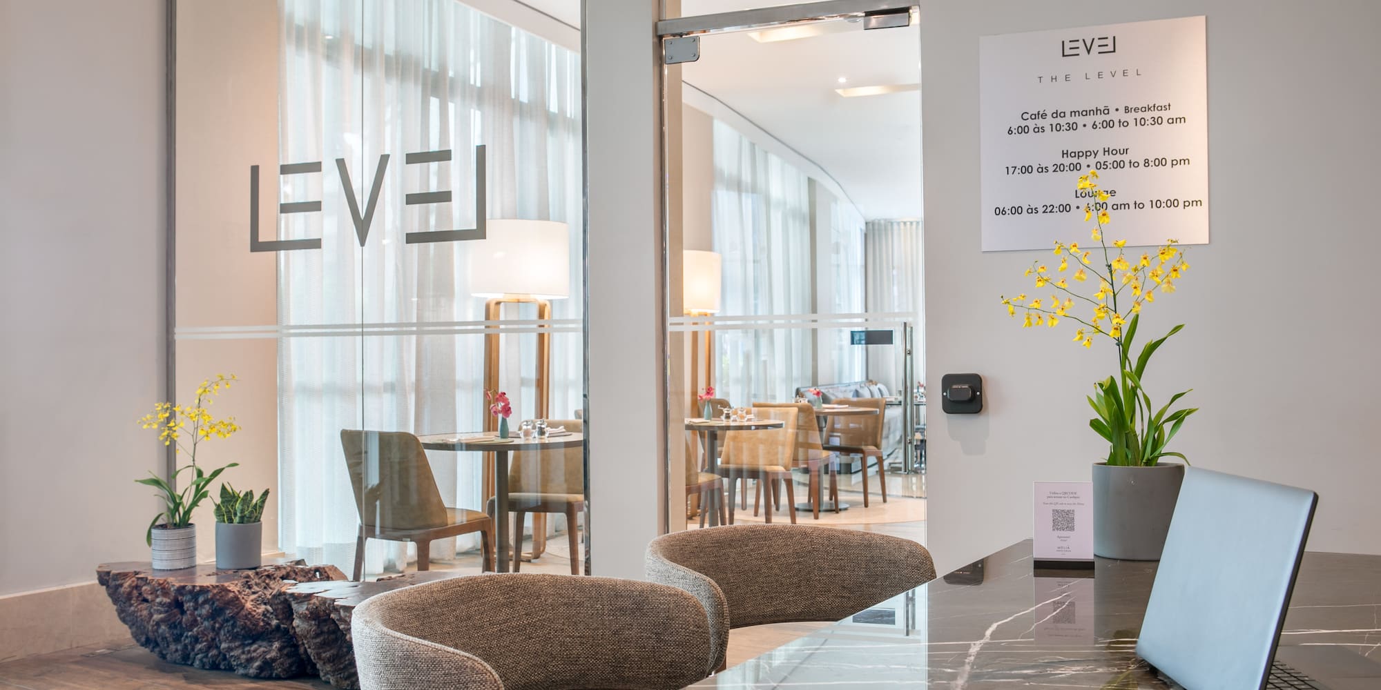 a room with a marble counter and chairs