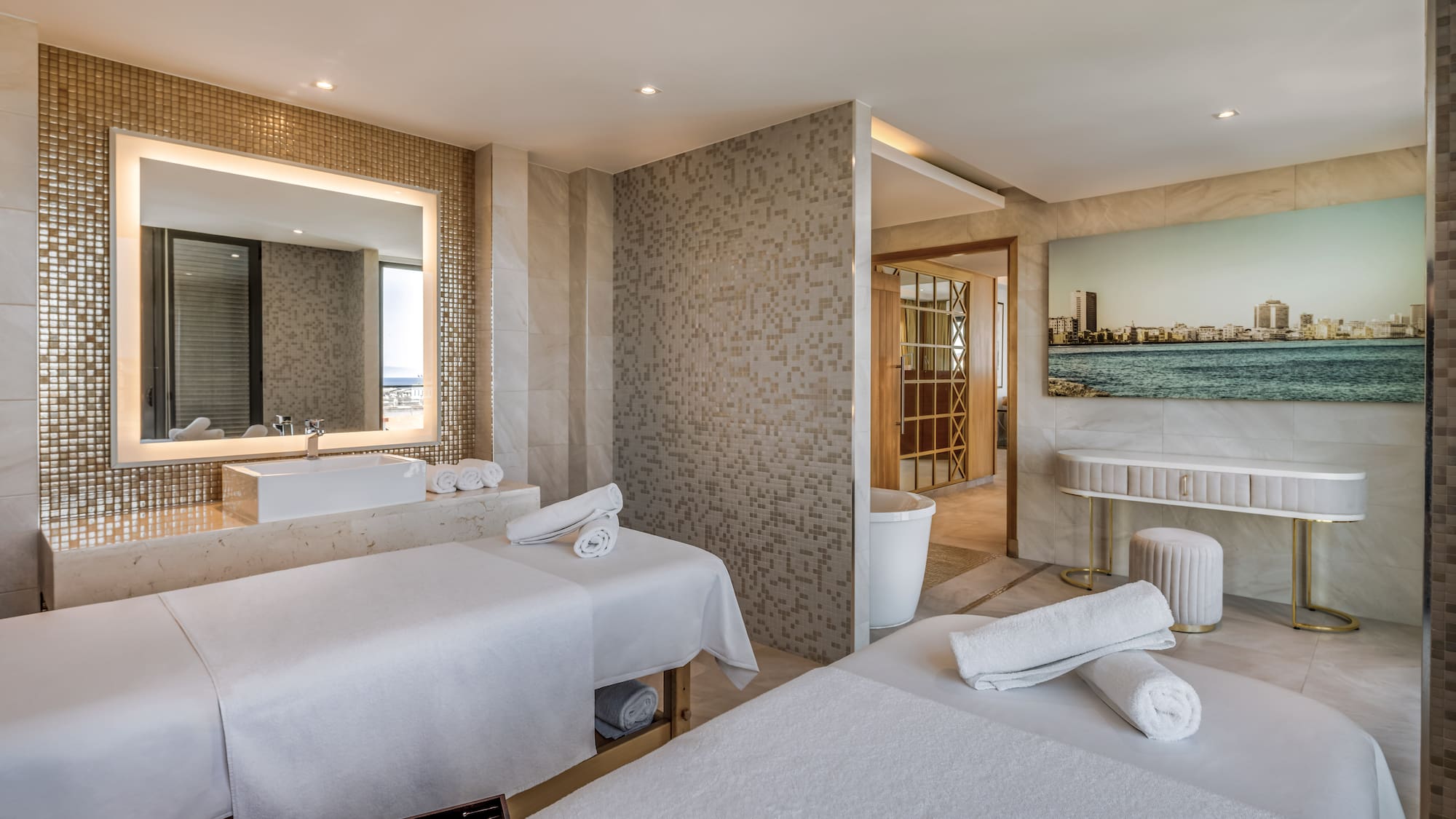 a room with beds and a sink