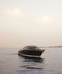 a black boat in the water