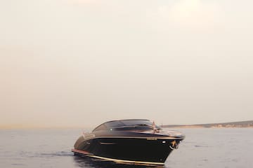 a black boat in the water