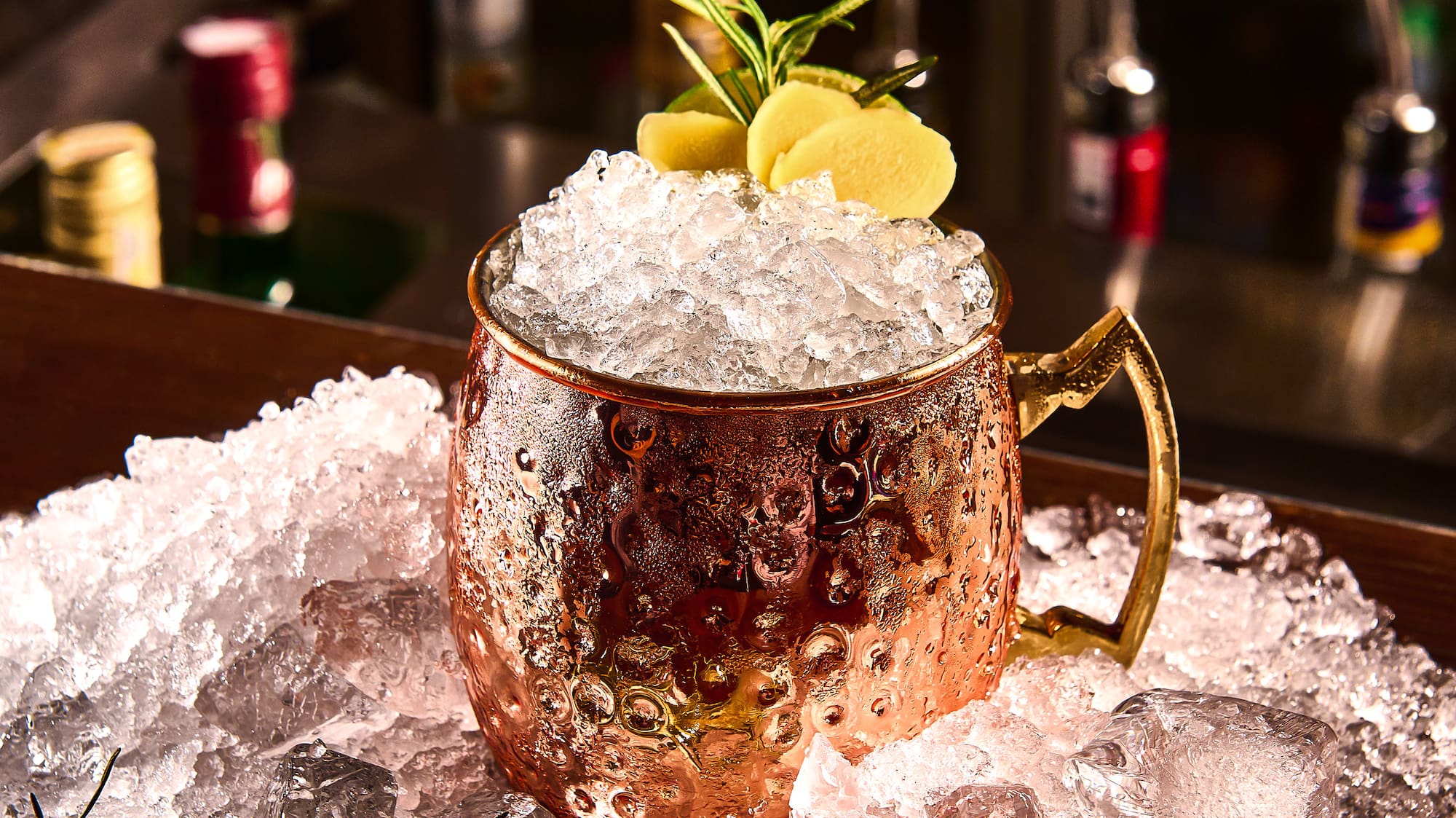 a copper mug with ice on top of it