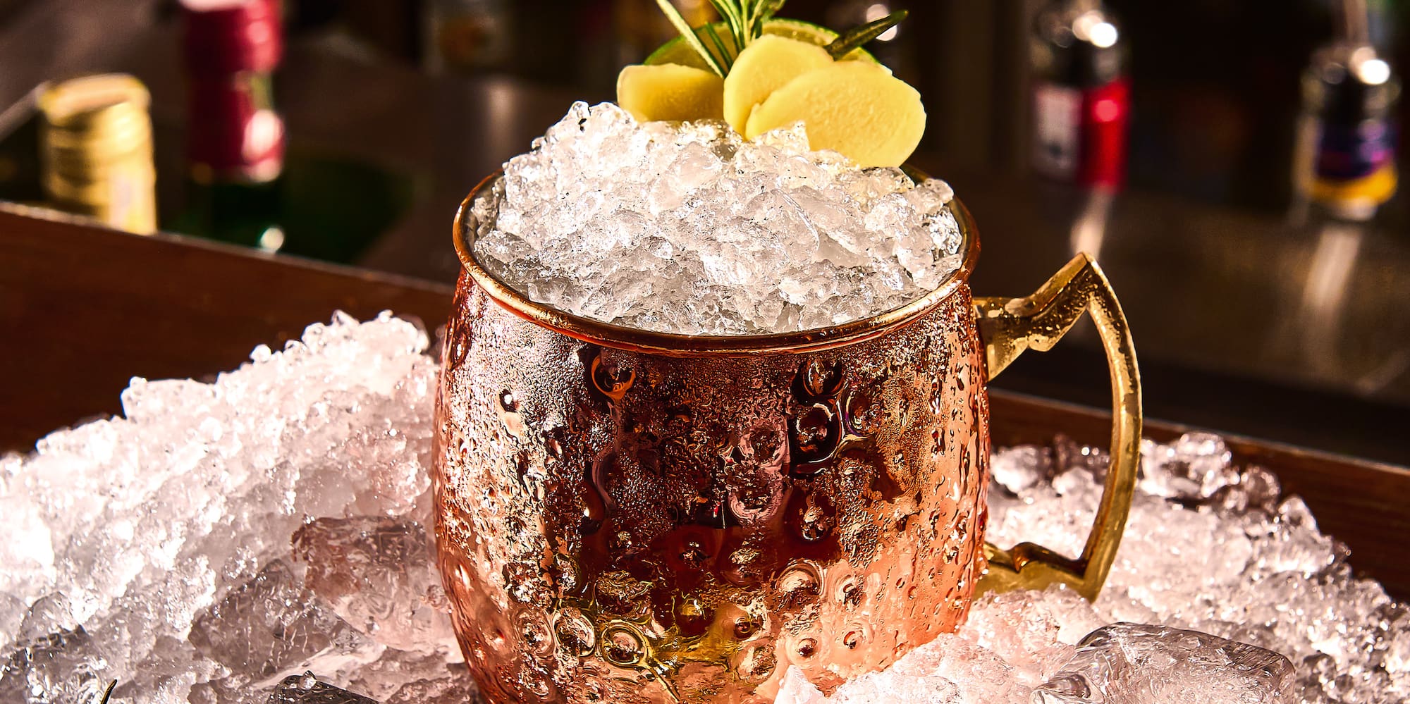 a copper mug with ice on top of it
