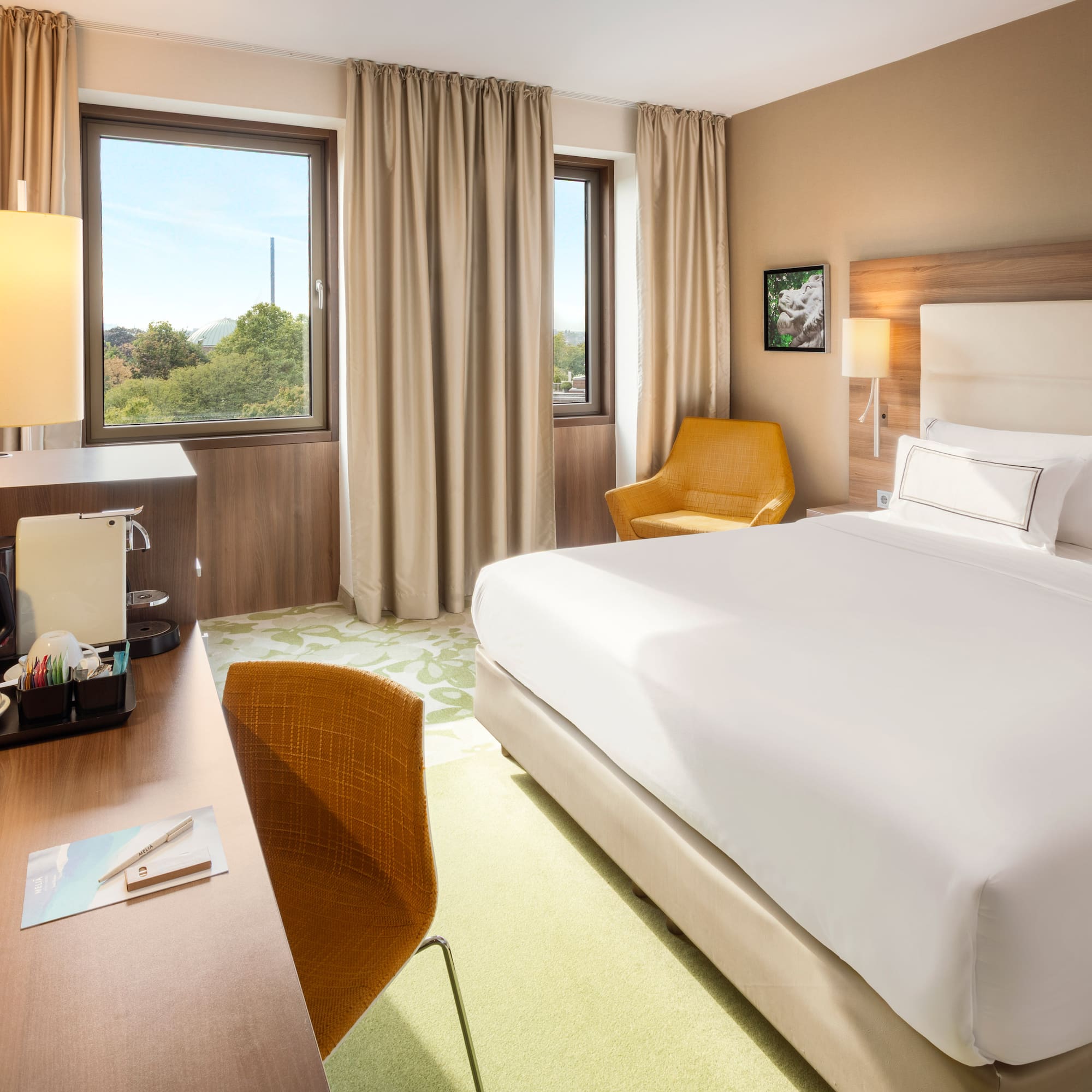 a room with a bed and a desk