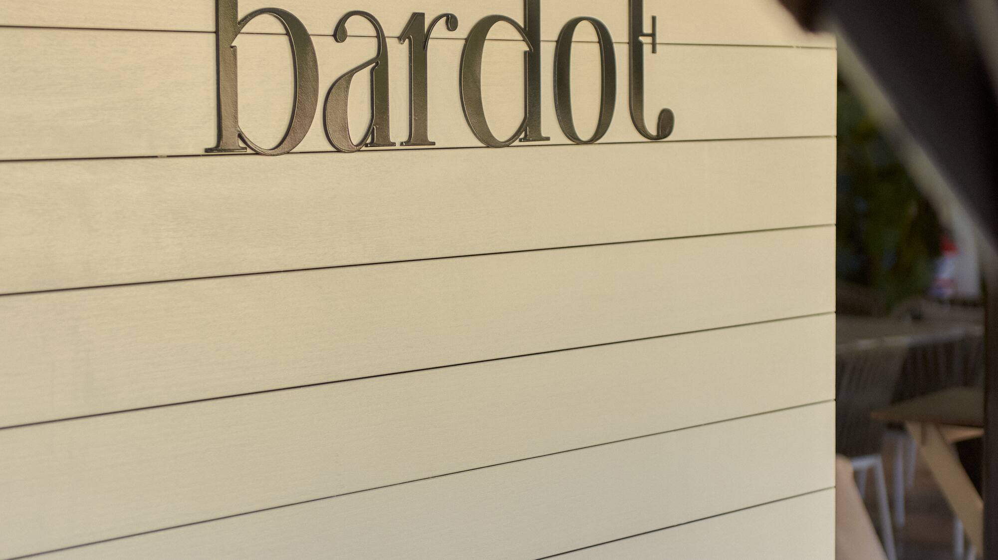 a sign with black text on it