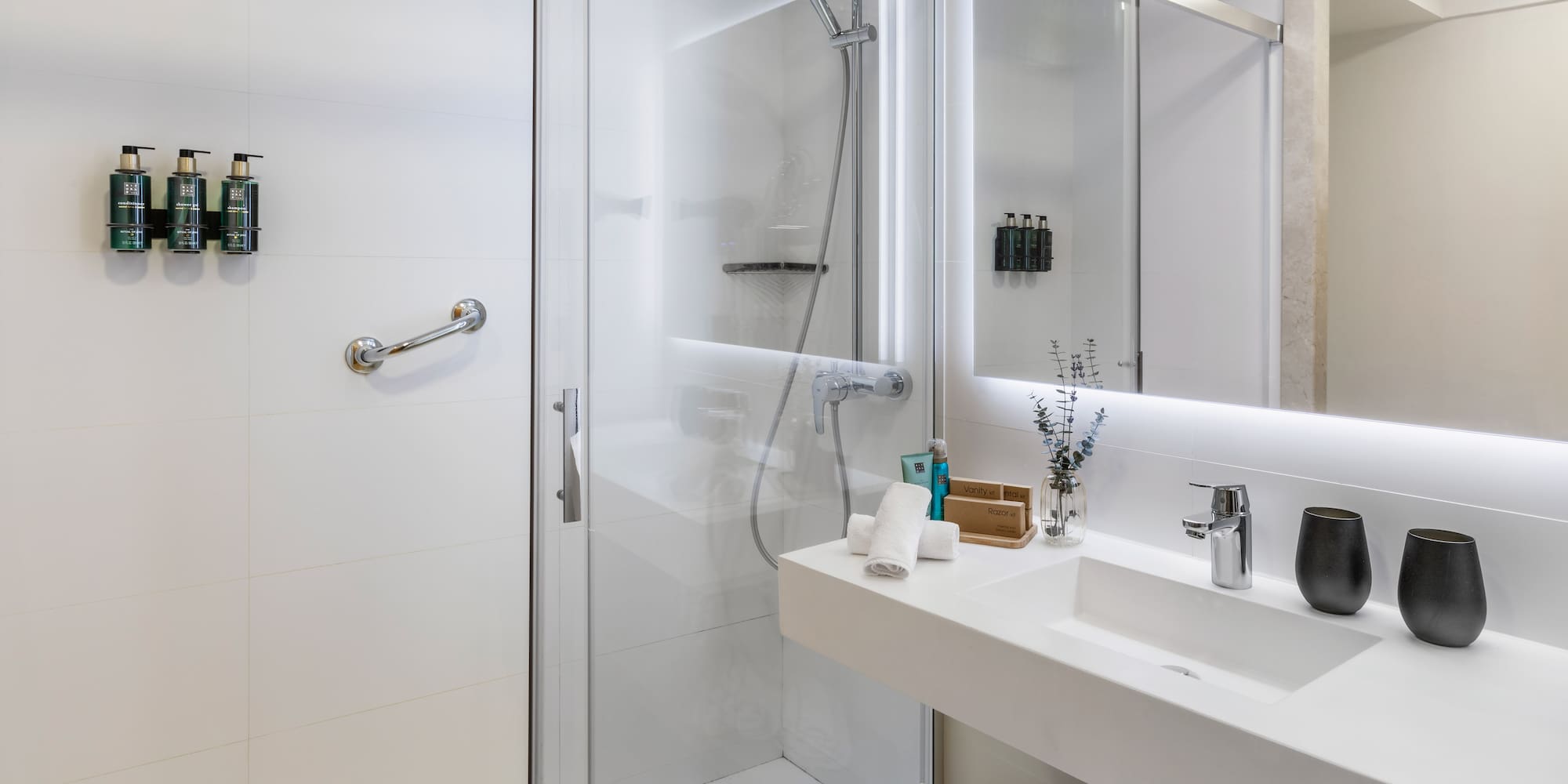 a bathroom with a shower and sink