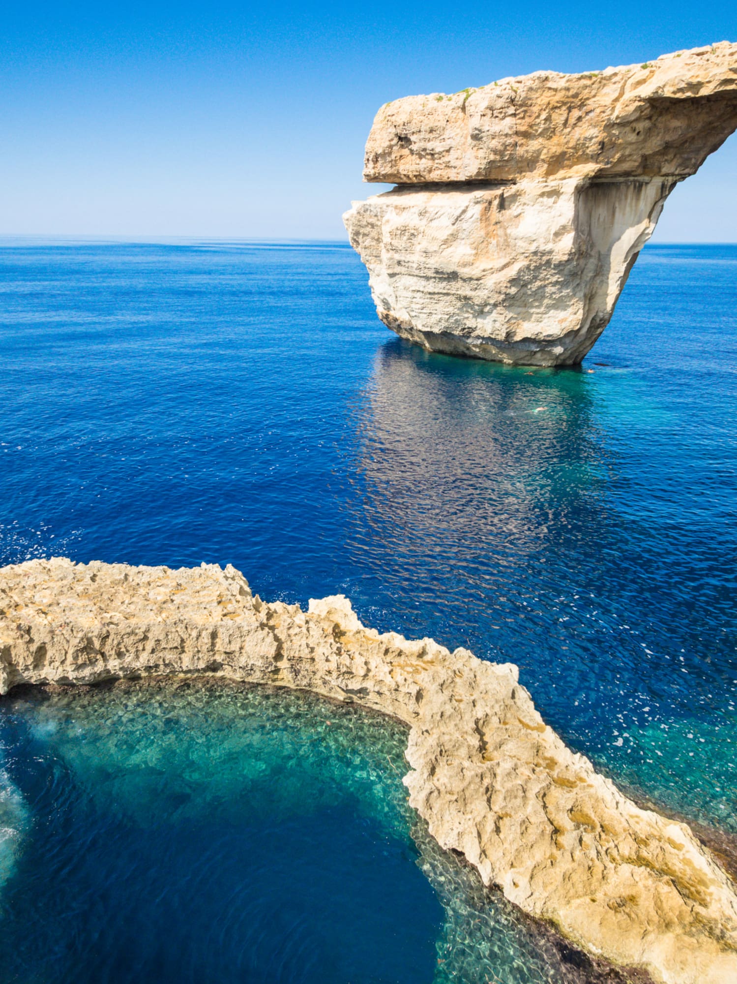 Azure Window natural arch over clear blue Gozo sea, Malta