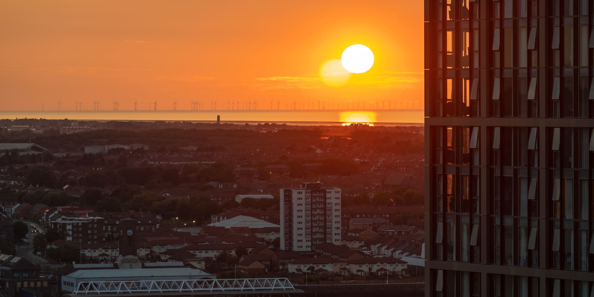 a sunset over a city