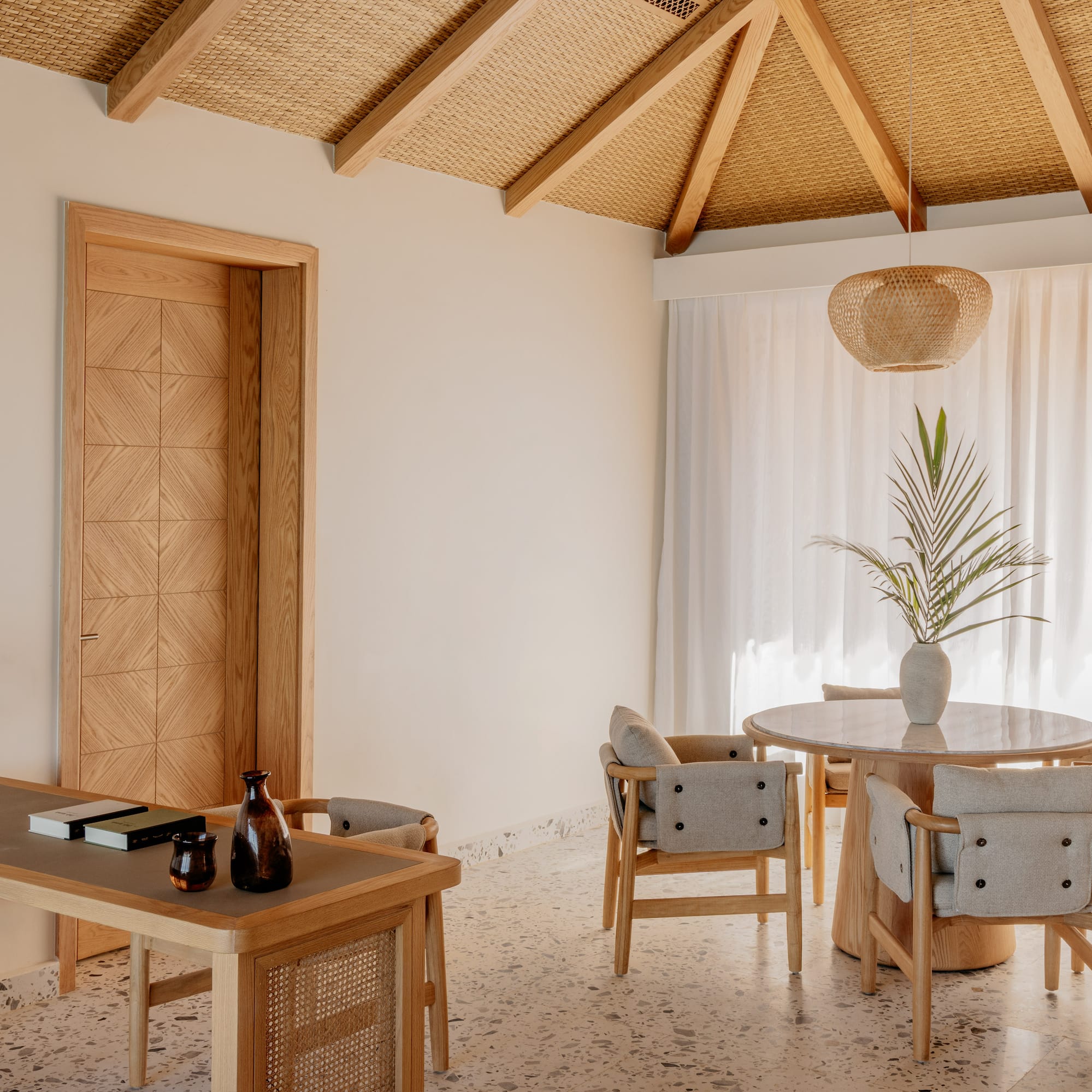 a room with a table and chairs