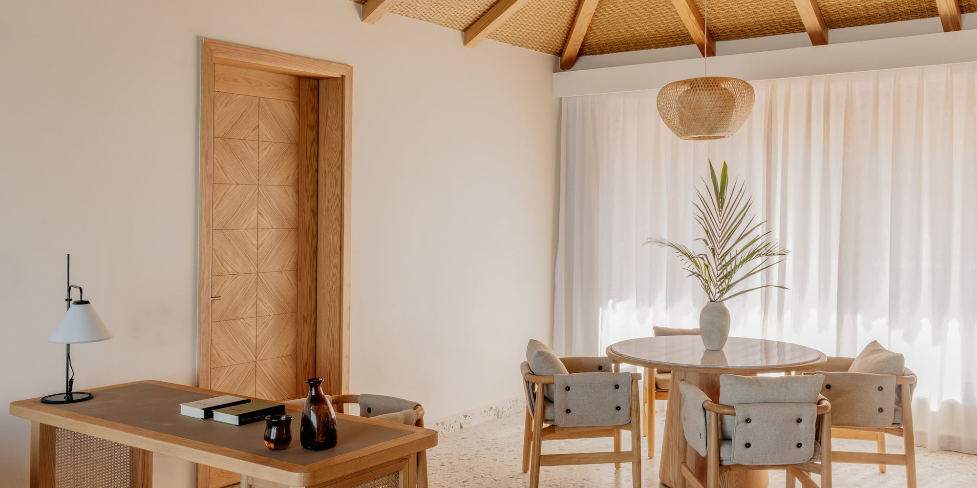 a room with a table and chairs