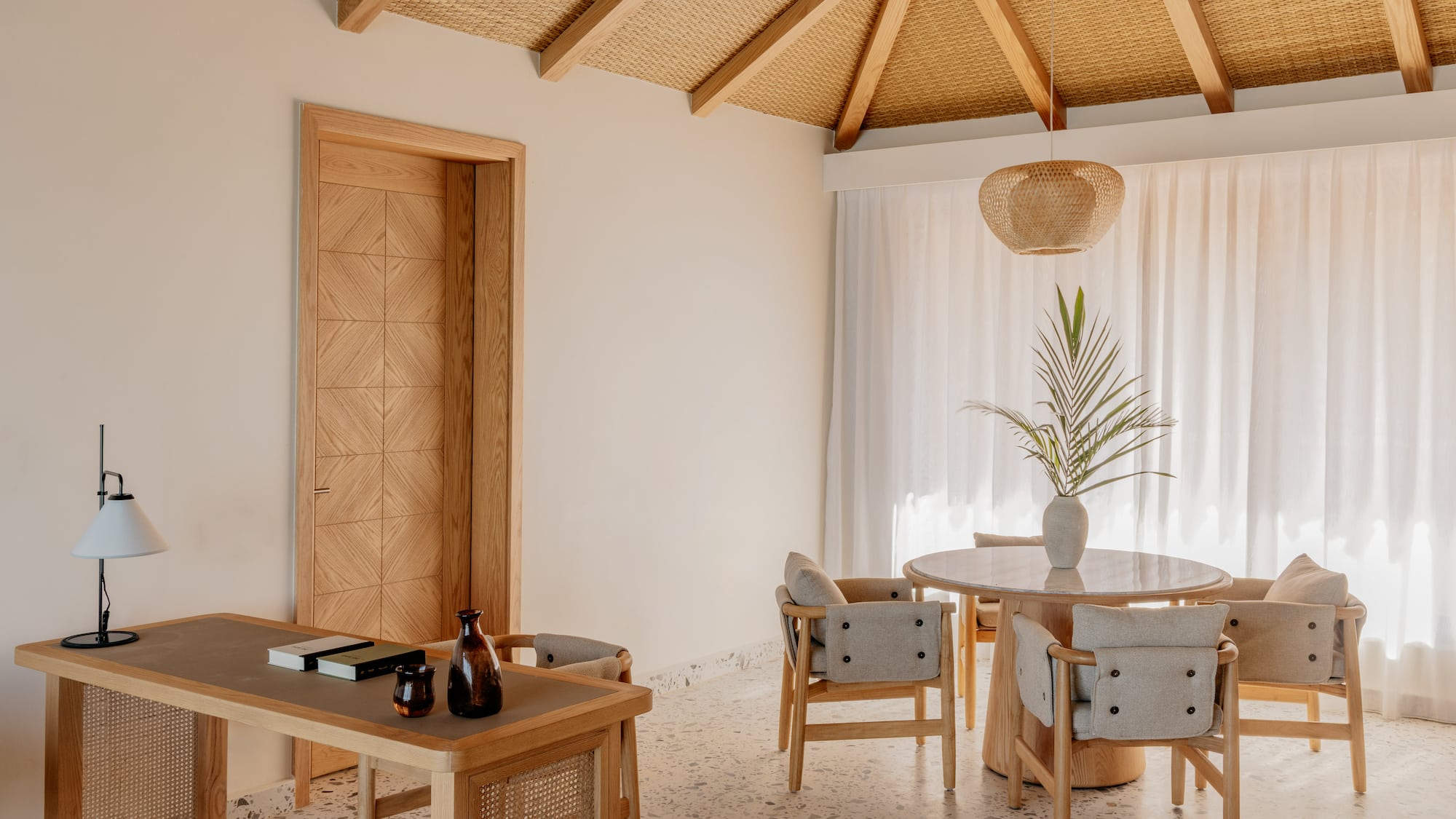 a room with a table and chairs