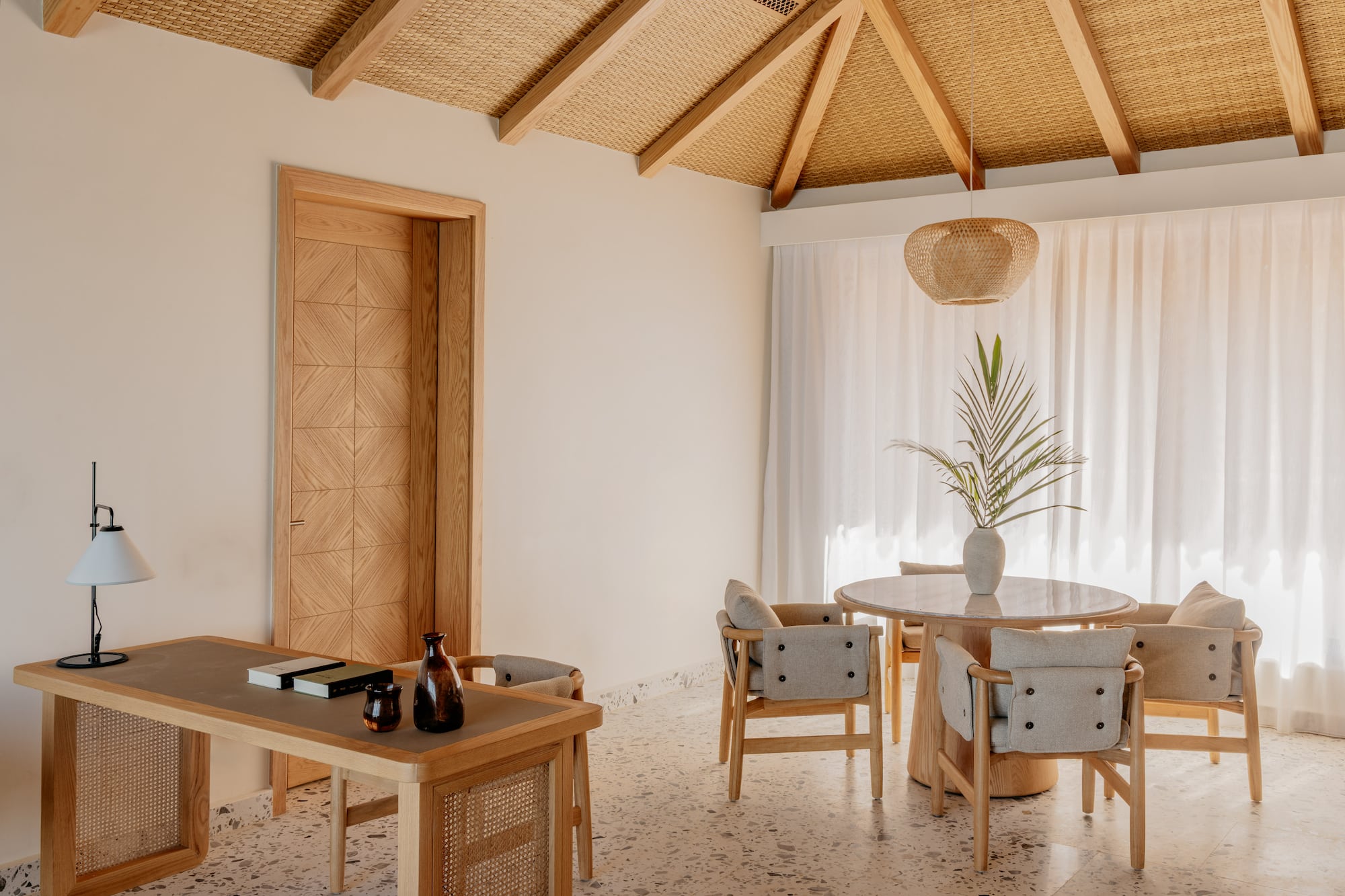 a room with a table and chairs