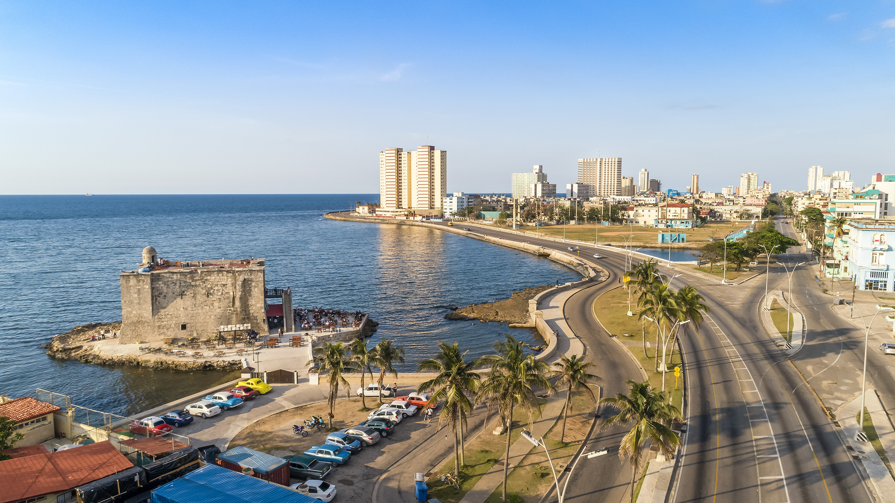 a road next to a body of water