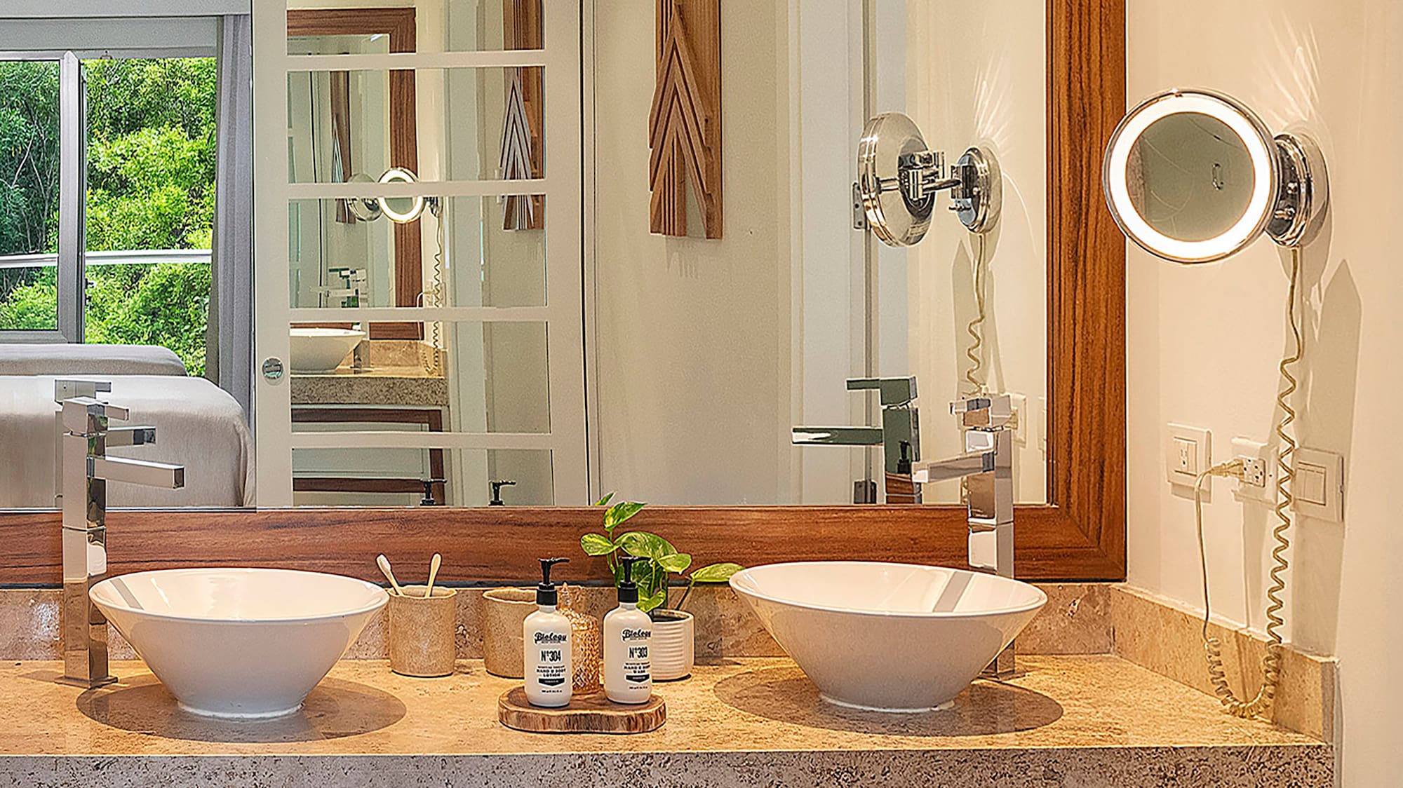 a bathroom with a mirror and two sinks