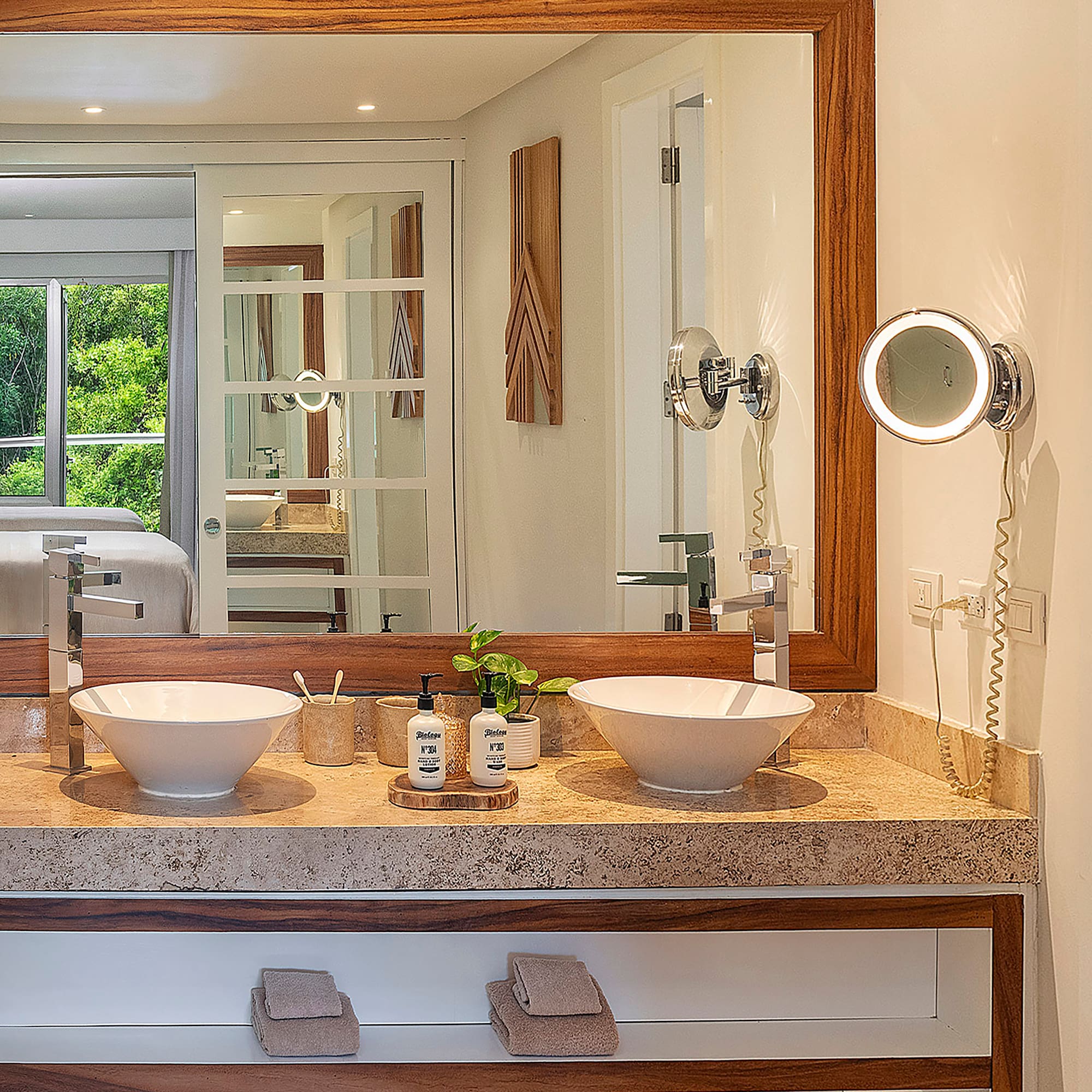 a bathroom with a mirror and two sinks