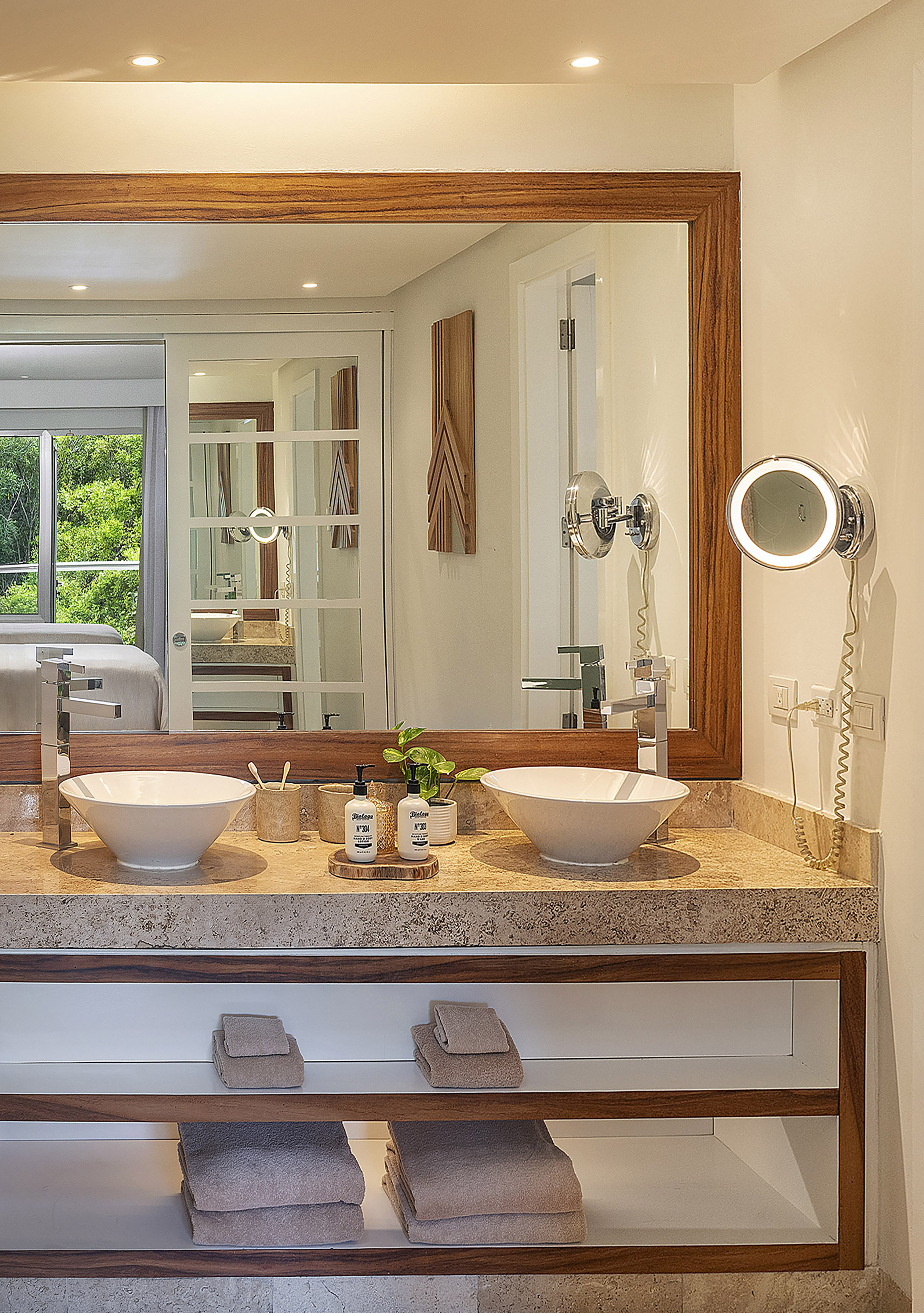 a bathroom with a mirror and two sinks