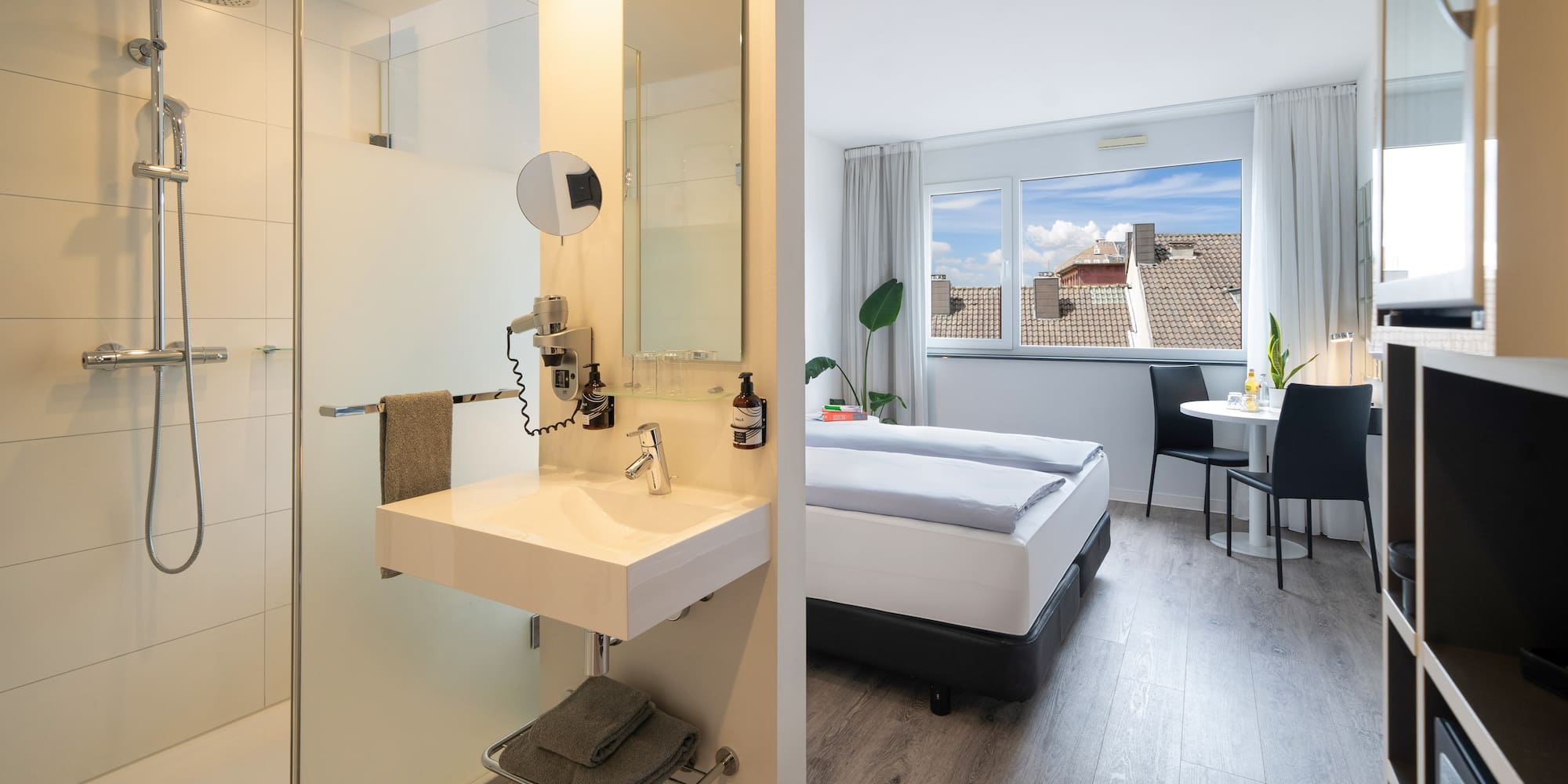 a room with a bed and a shower