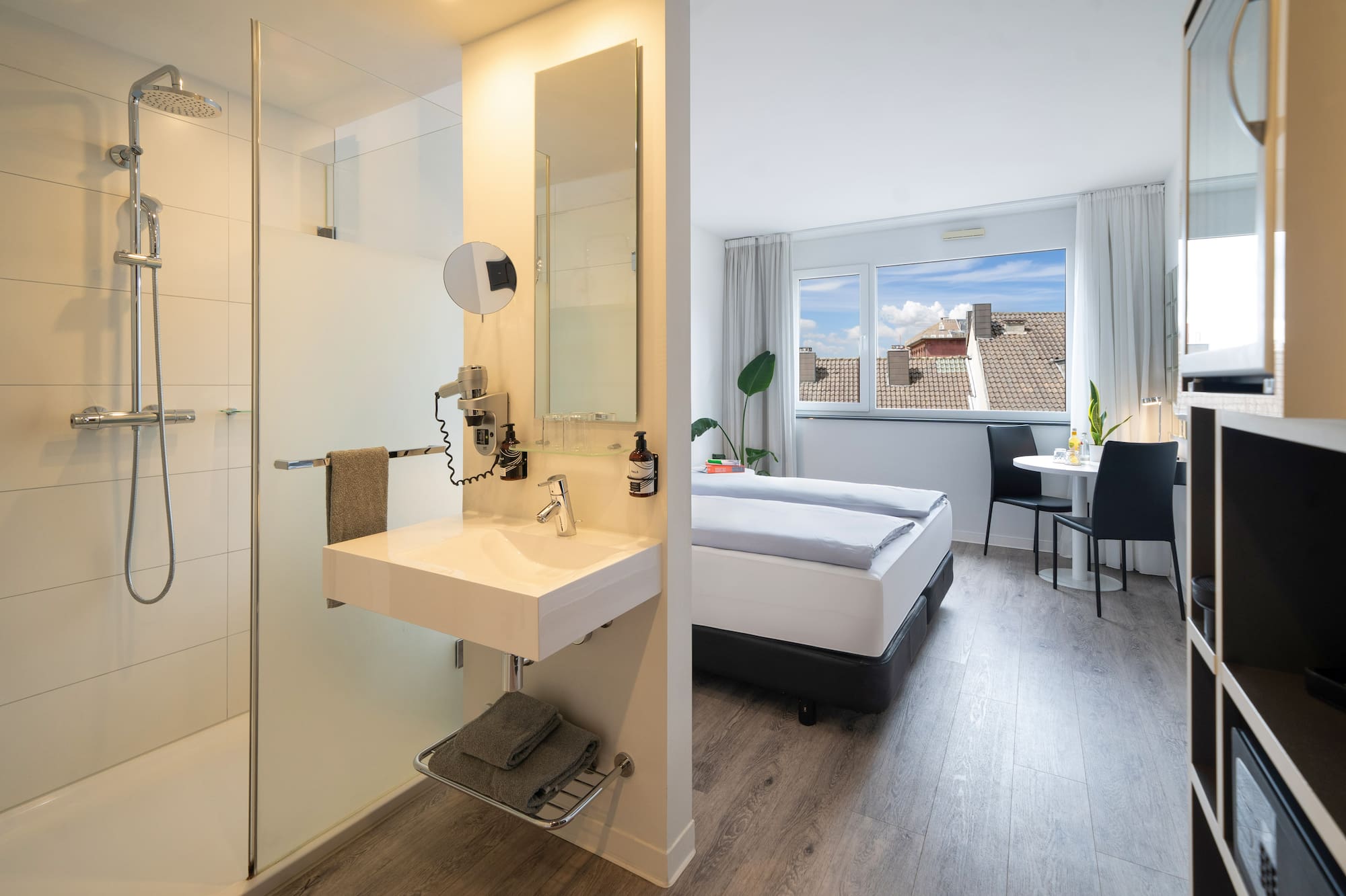 a room with a bed and a shower