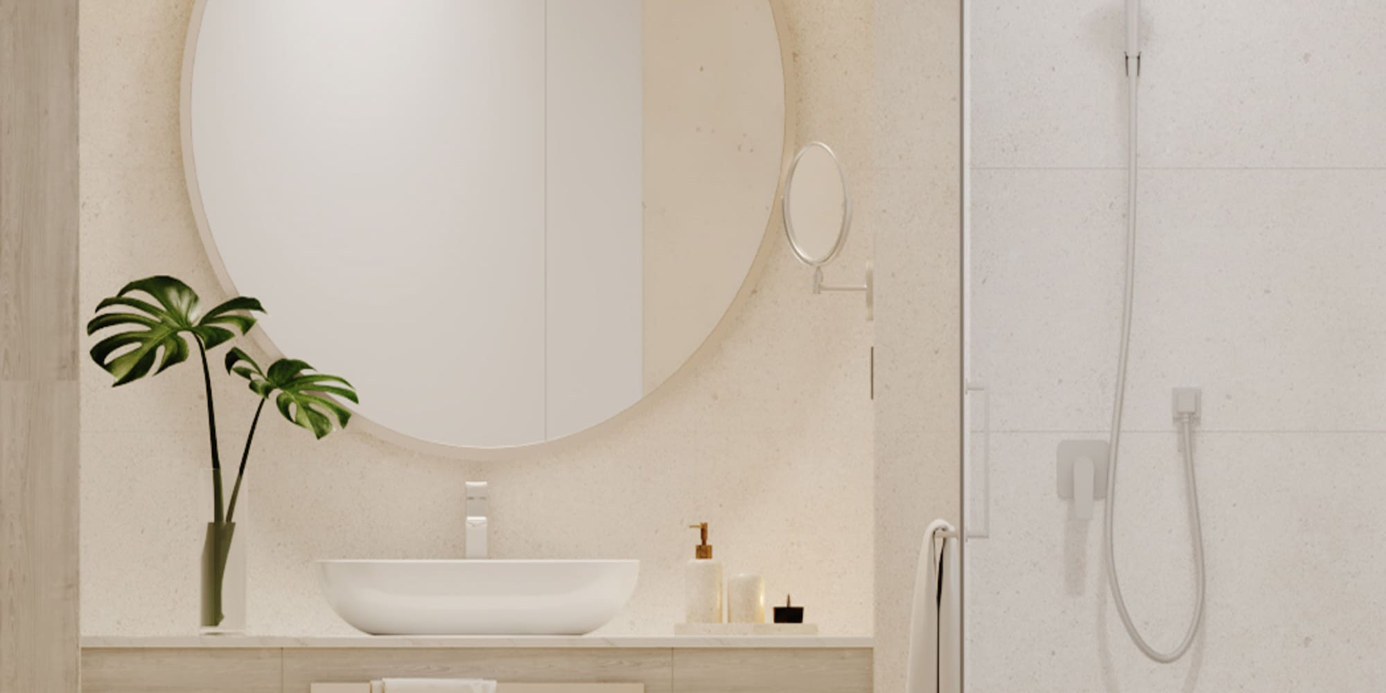 Minimalist bathroom with round mirror, wood vanity, plant decor, and shower.