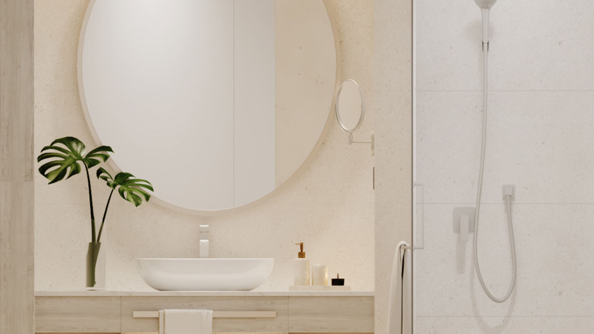 Minimalist bathroom with round mirror, wood vanity, plant decor, and shower.