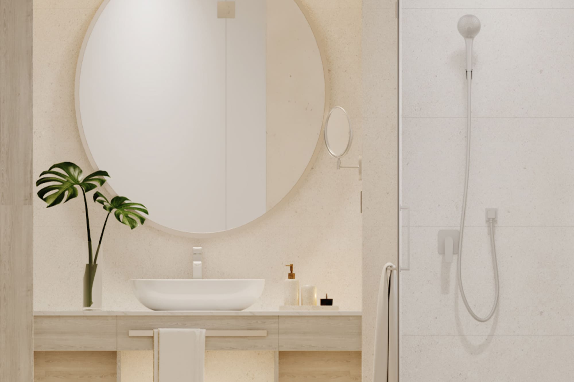 Minimalist bathroom with round mirror, wood vanity, plant decor, and shower.