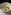 a bowl of green soup with shrimp