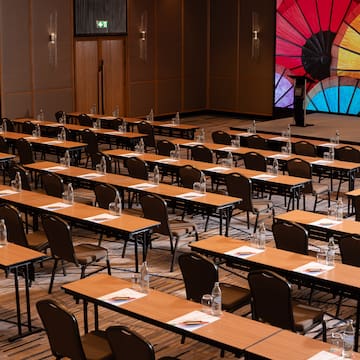 a large room with tables and chairs