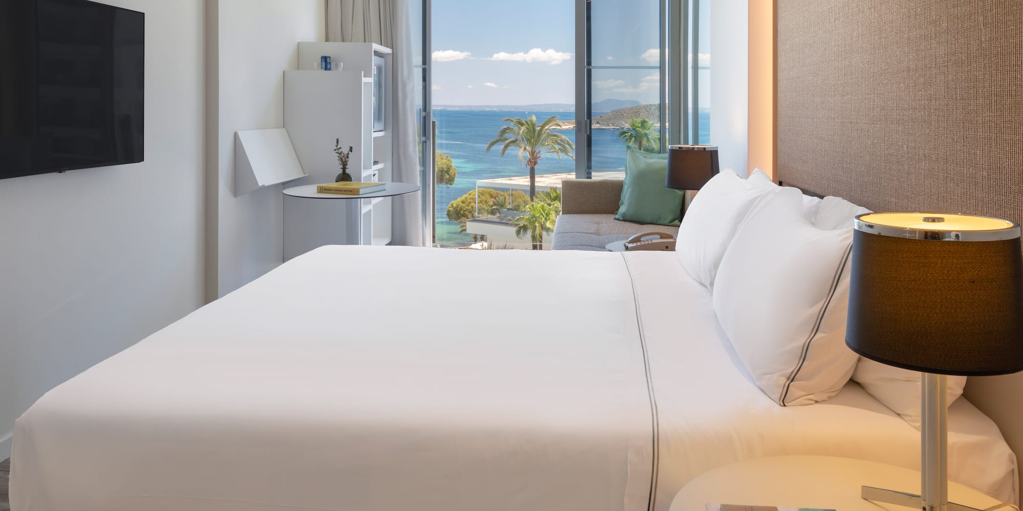 a bed with a view of the ocean