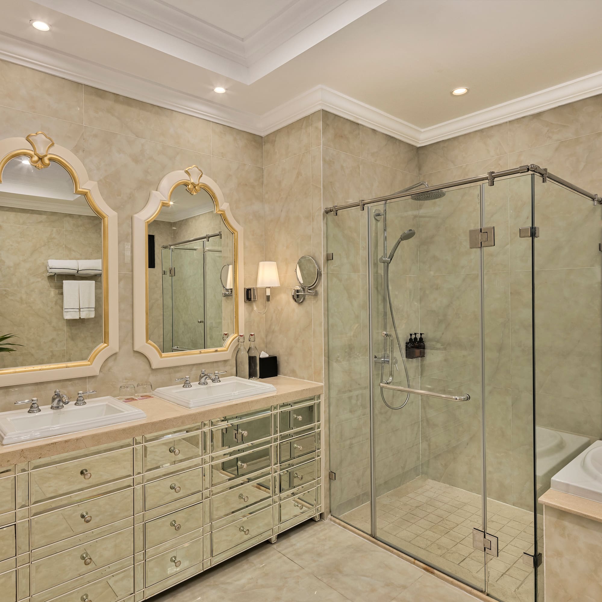 a bathroom with a glass shower and sink