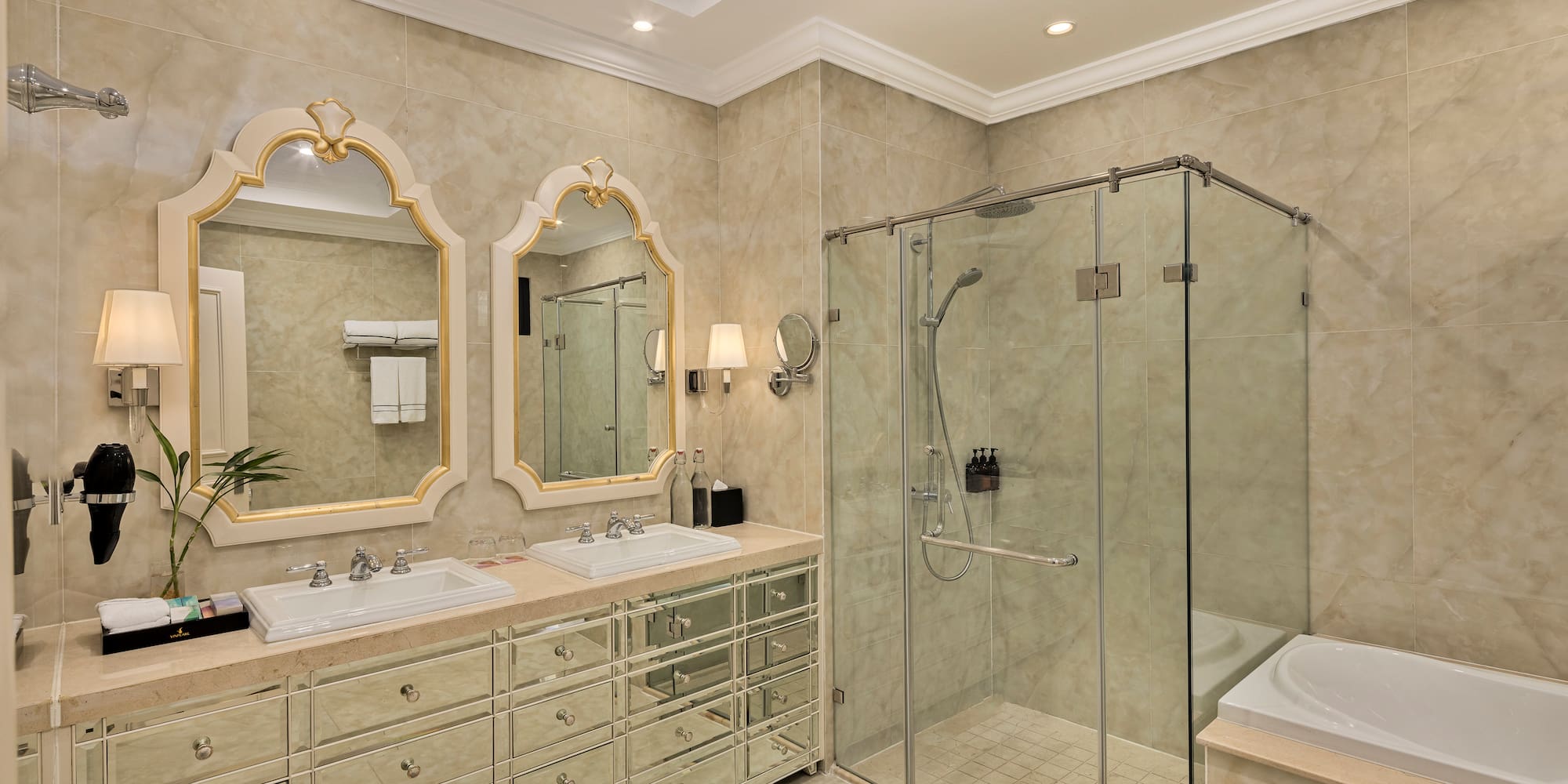 a bathroom with a glass shower and sink