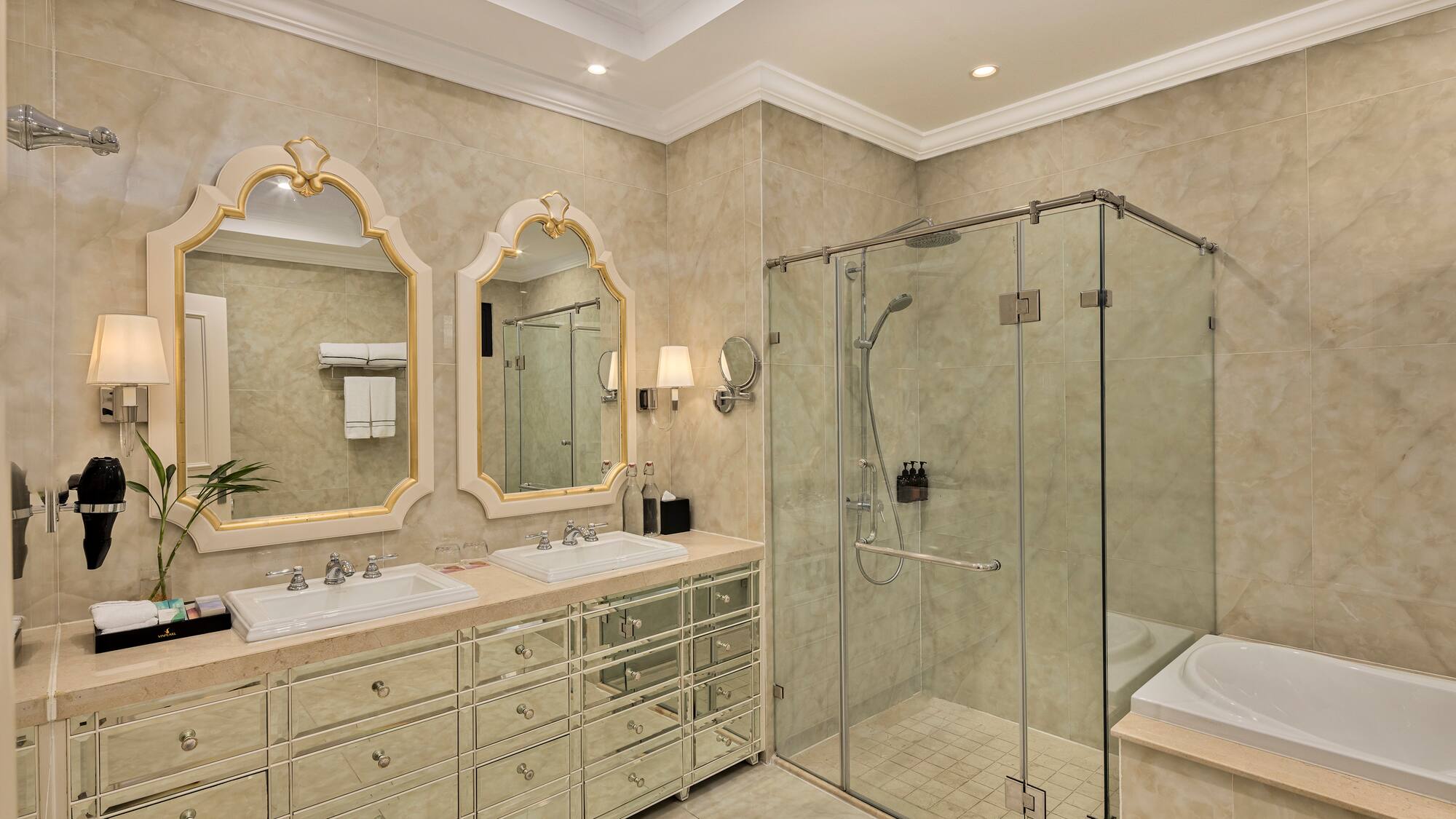 a bathroom with a glass shower and sink