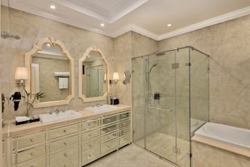 a bathroom with a glass shower and sink