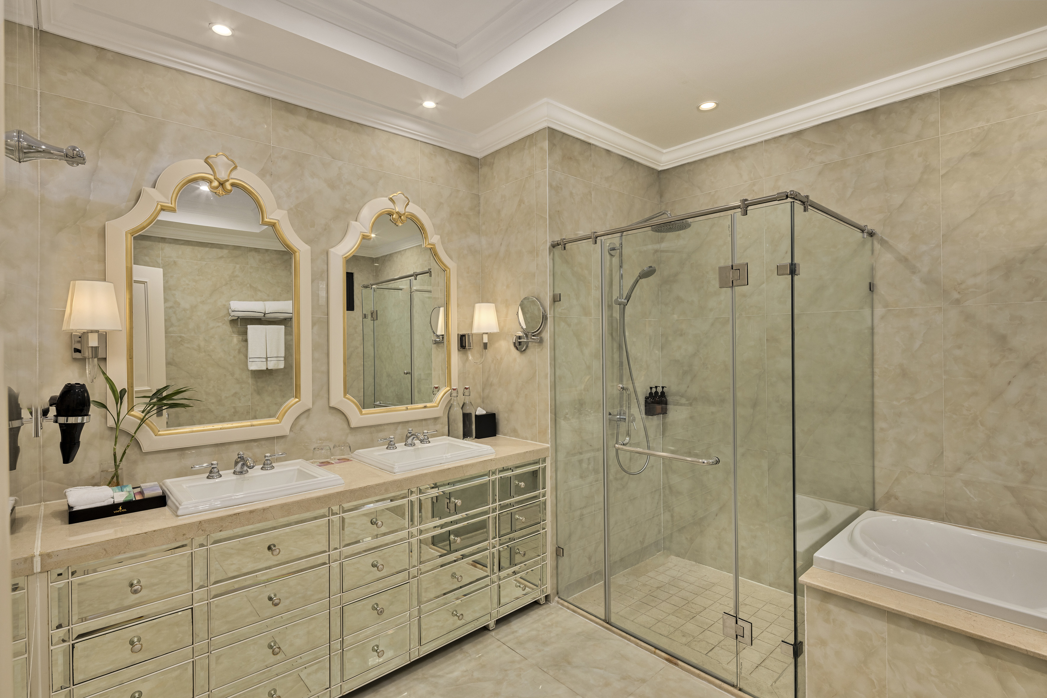 a bathroom with a glass shower and sink