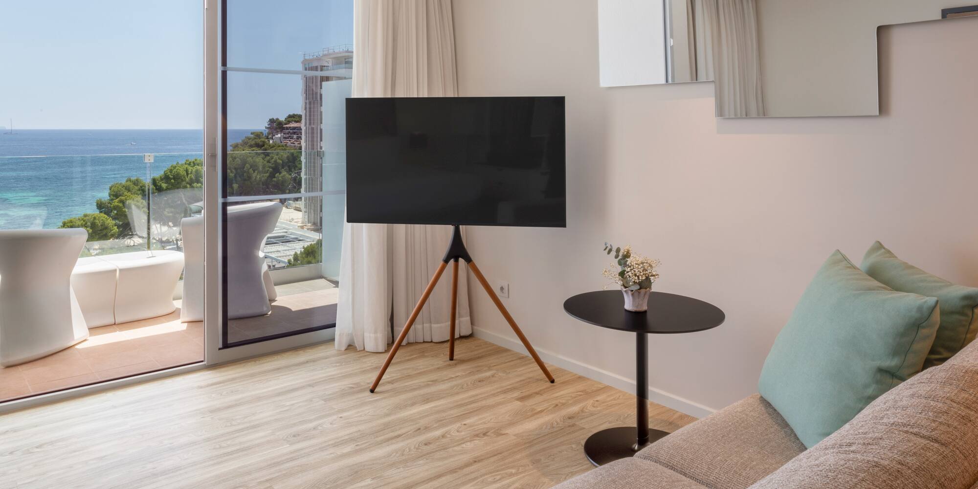 a living room with a television and a couch
