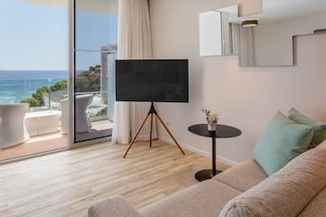 a living room with a television and a couch