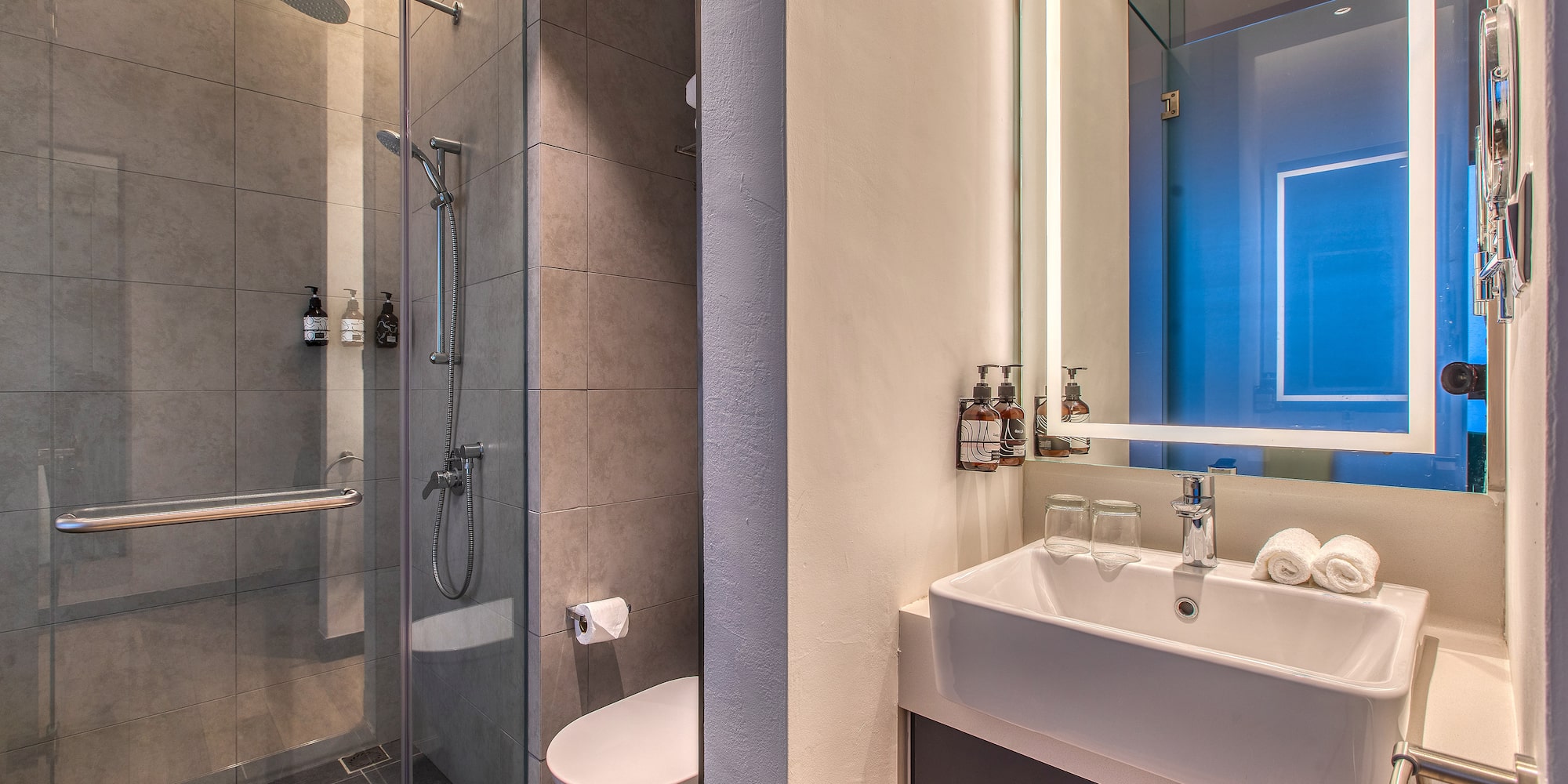 a bathroom with a shower and sink