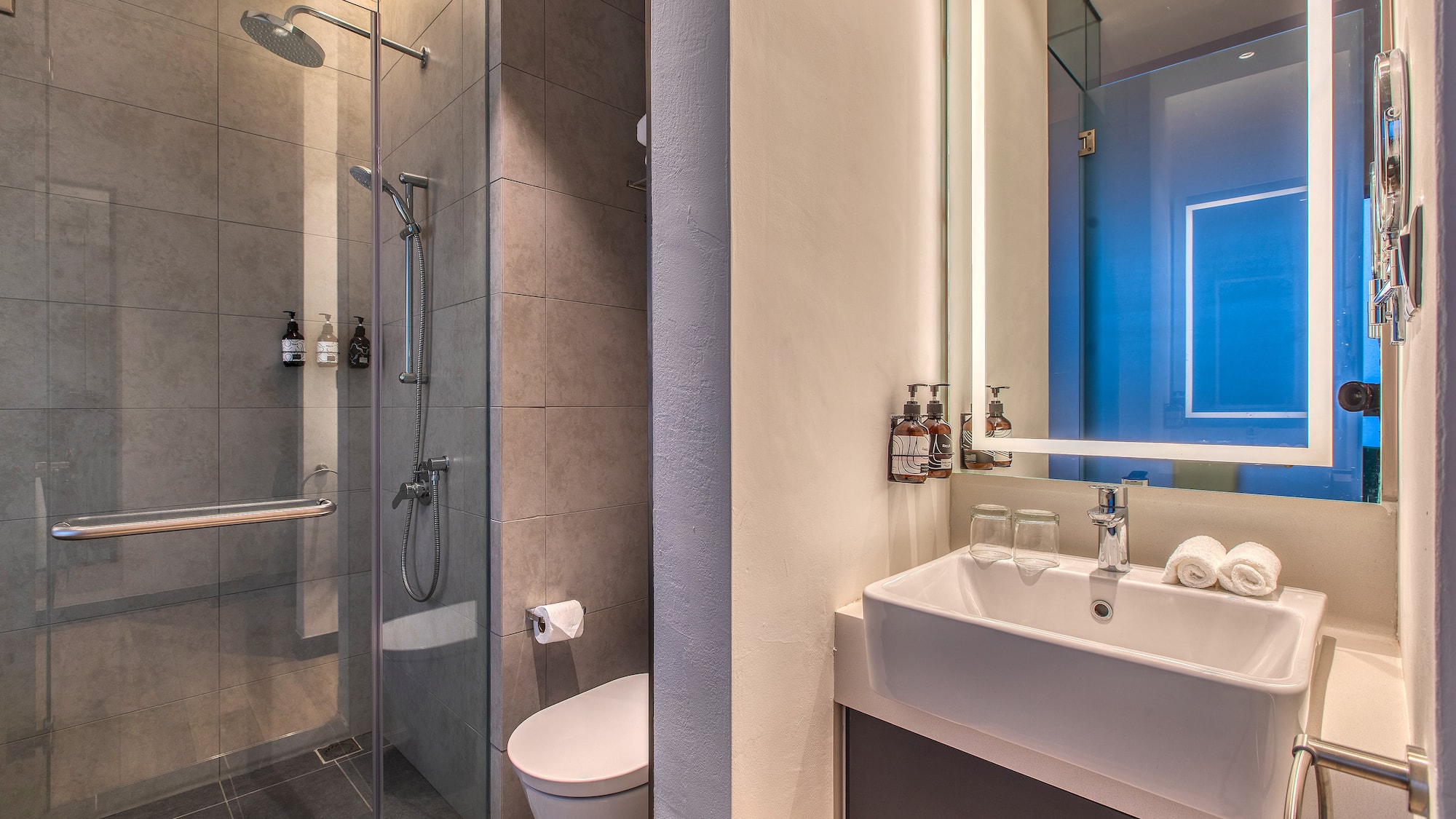 a bathroom with a shower and sink