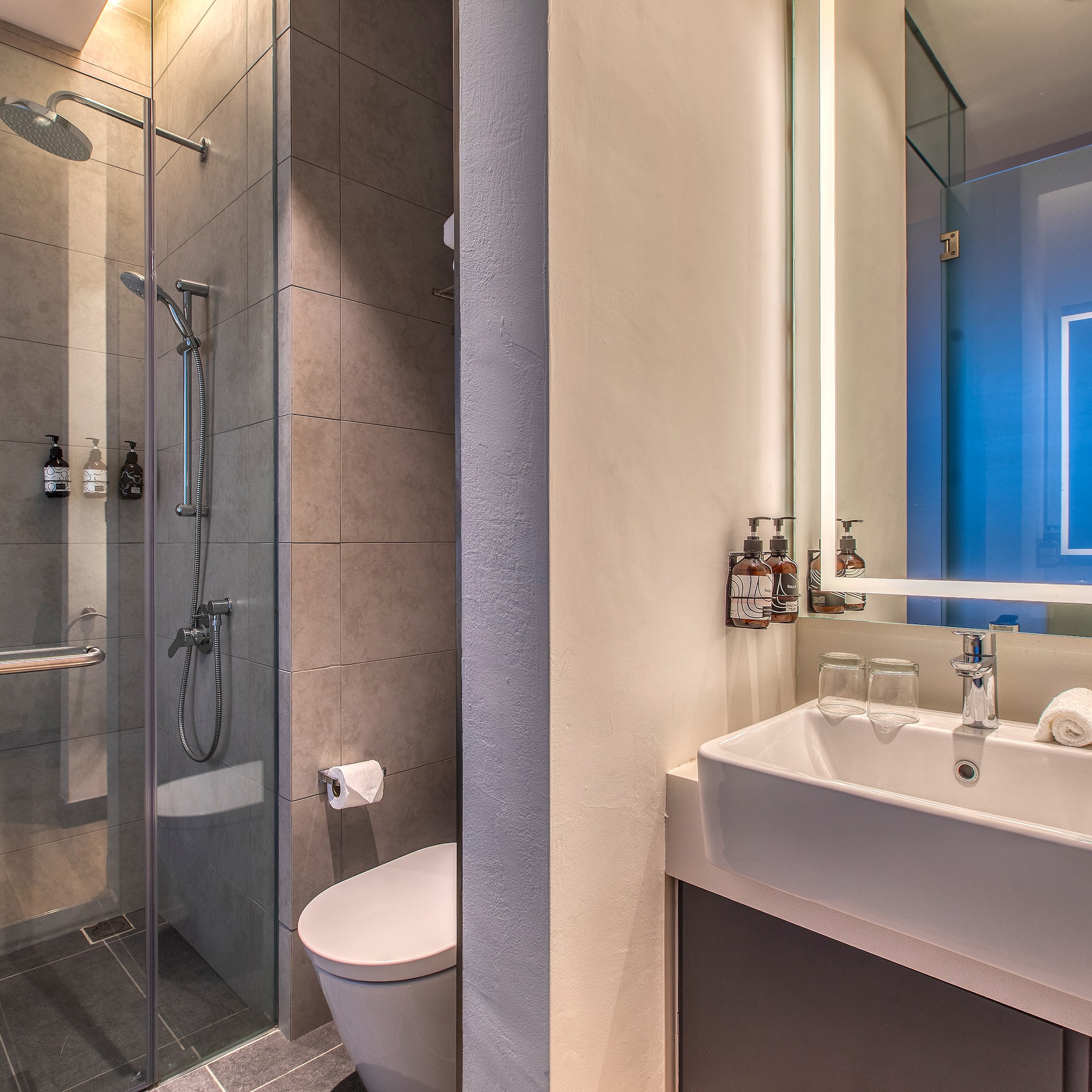 a bathroom with a shower and sink