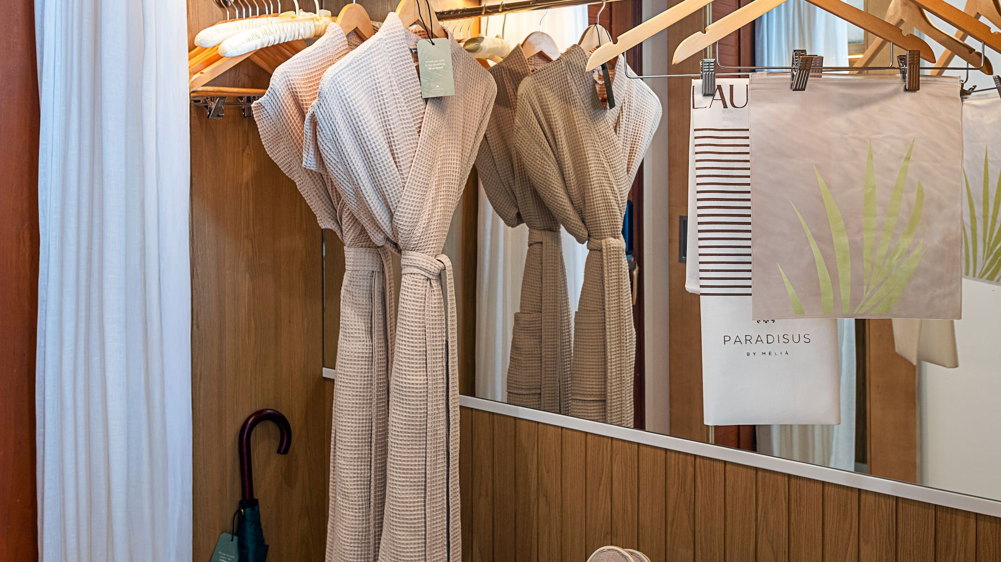 a bathroom with towels and towels on swingers