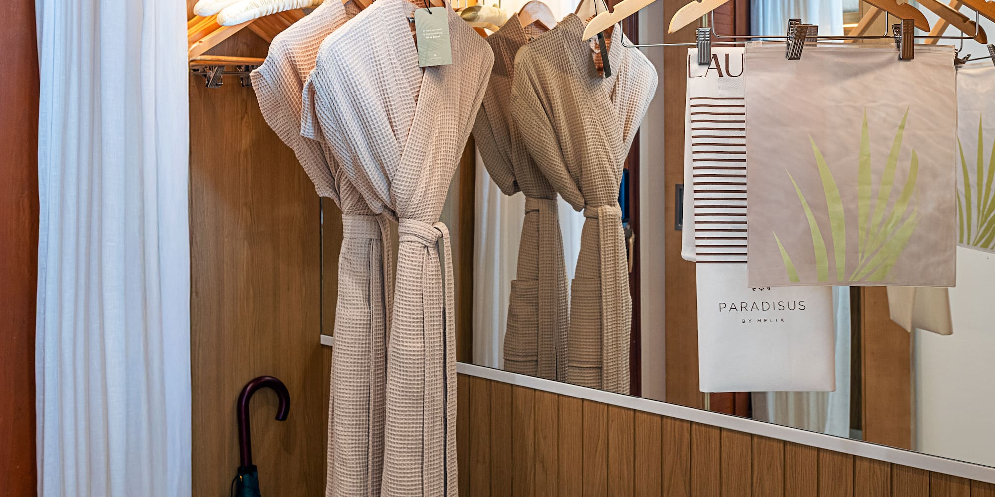 a bathroom with towels and towels on swingers